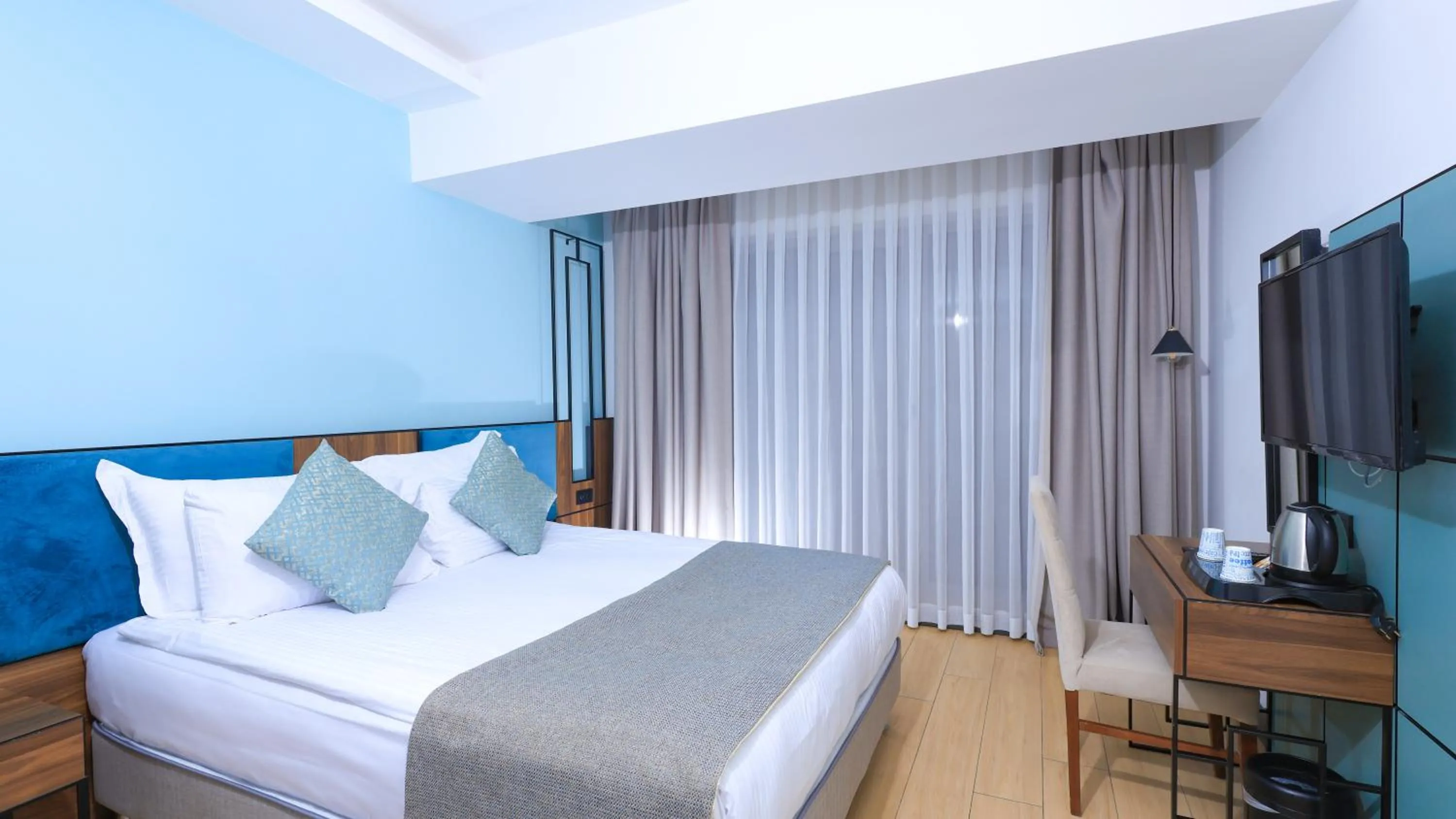 Bed in Leaf Port Hotel