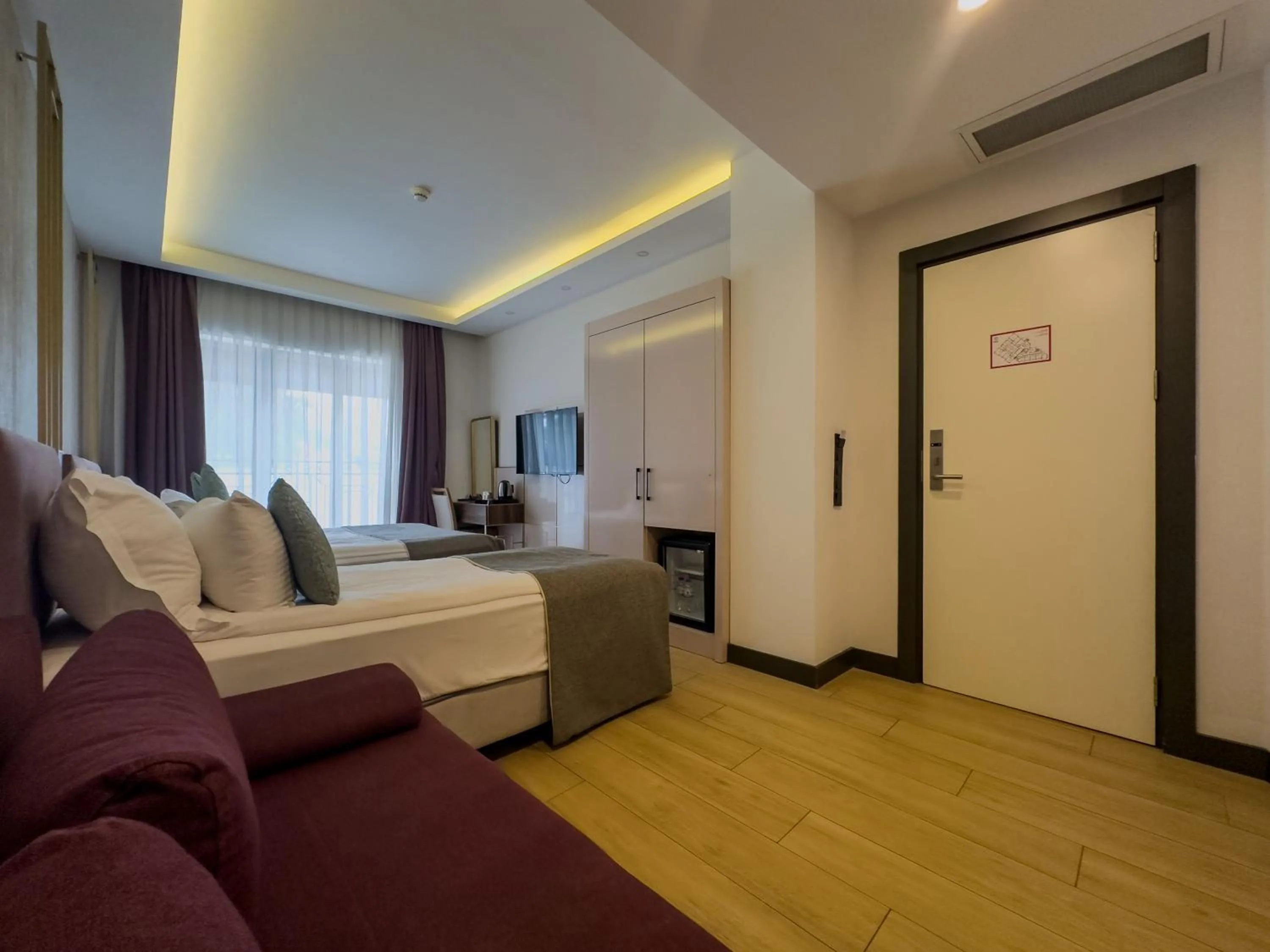 Bed in Leaf Port Hotel