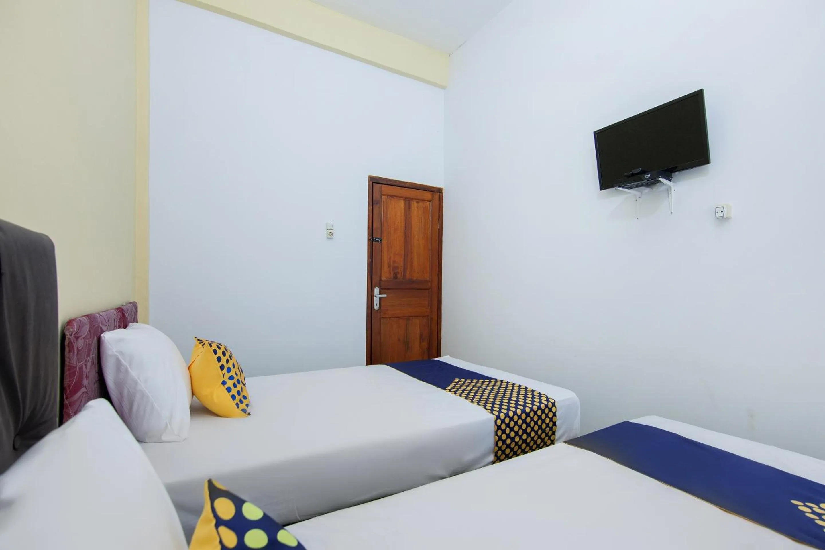 Bedroom, Bed in SPOT ON 2076 Hotel Stadion