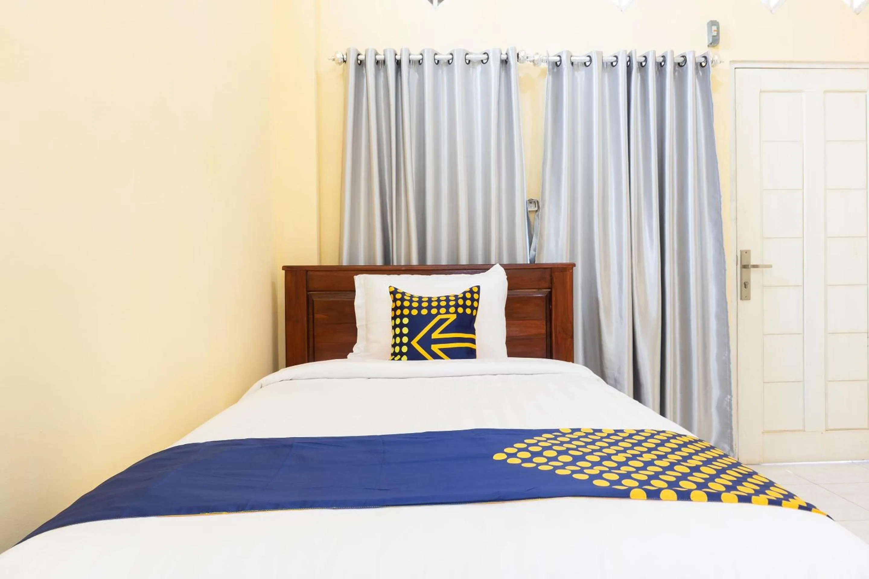 Bedroom in SPOT ON 2063 Bethania Residence