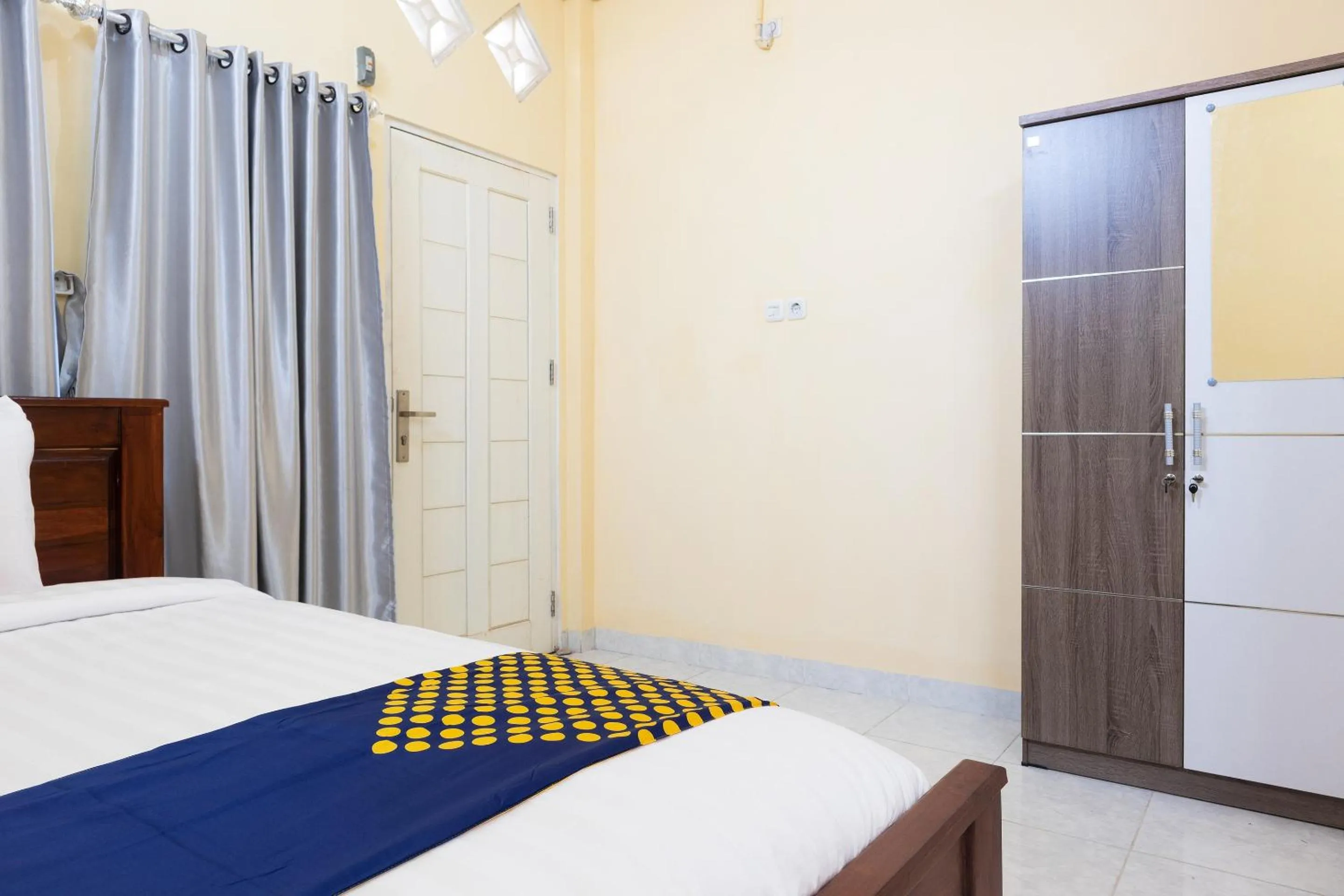 Bedroom in SPOT ON 2063 Bethania Residence