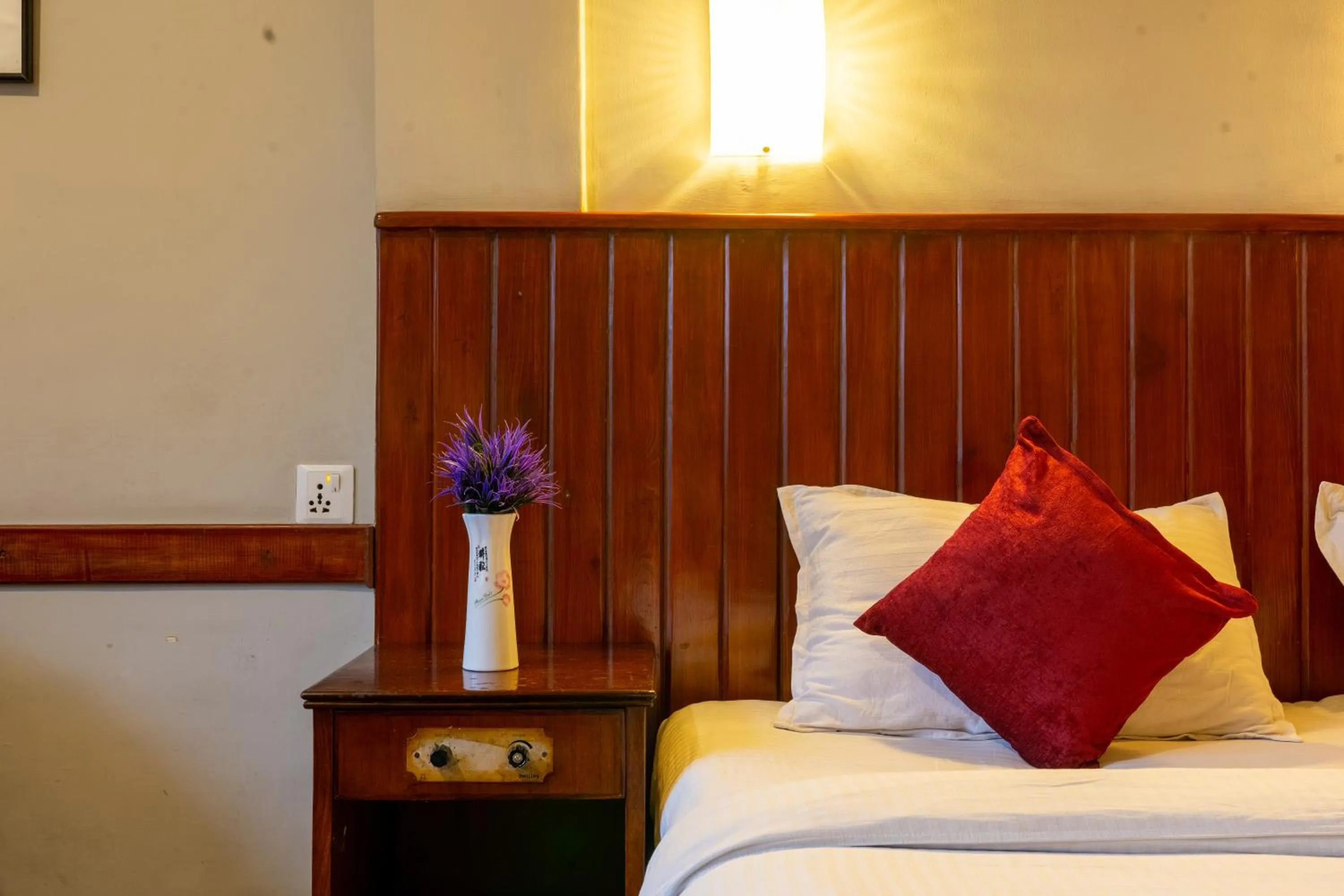 Bed in Mystic Homes Hotel