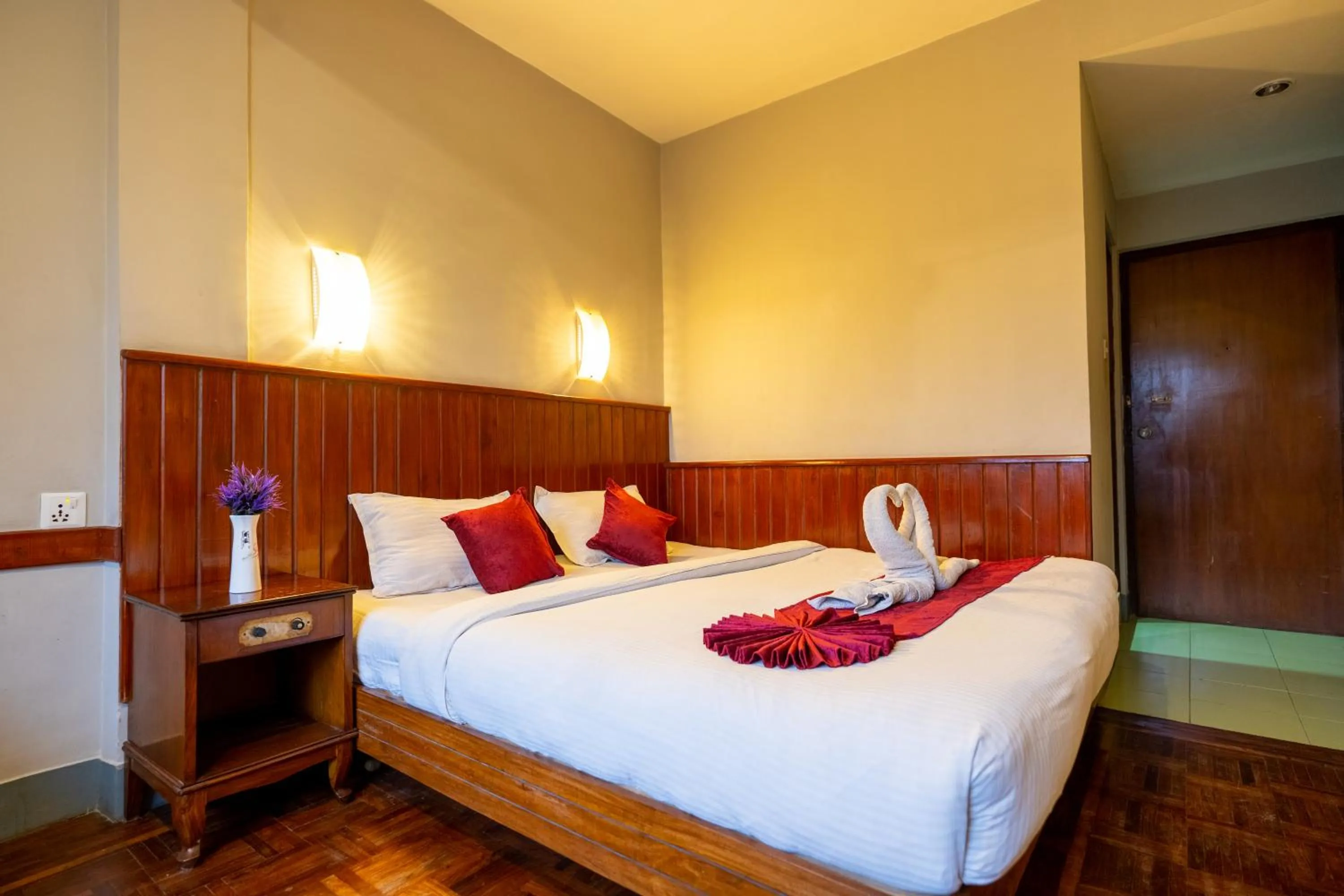 Bed in Mystic Homes Hotel