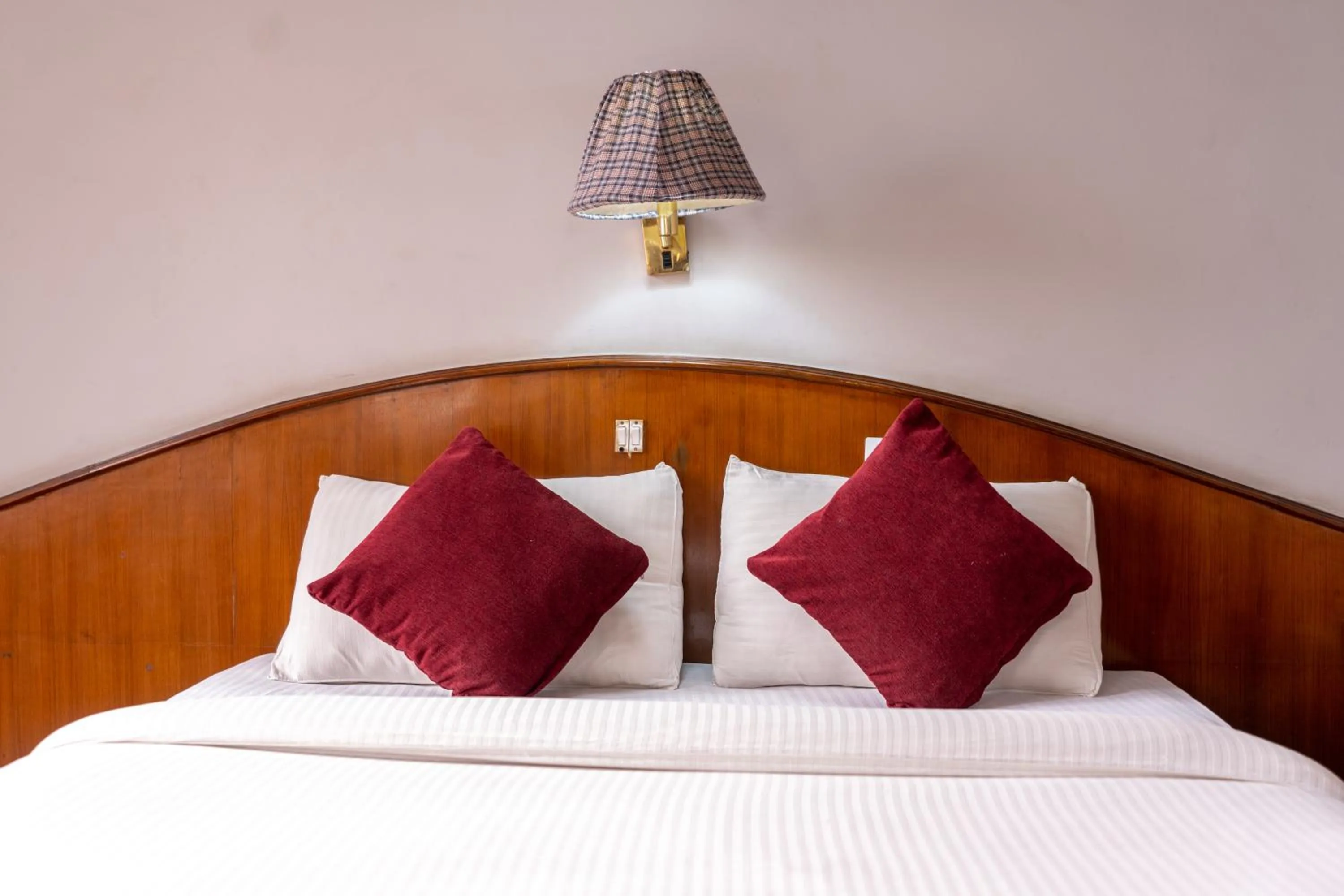 Bed in Mystic Homes Hotel