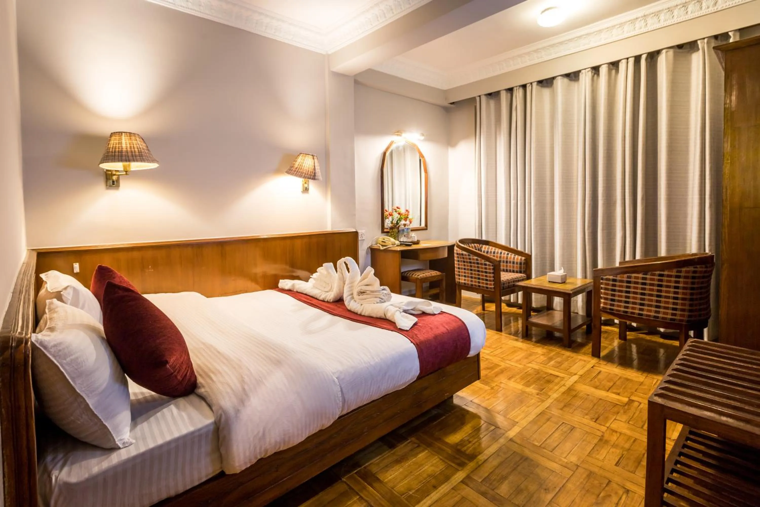 Bed in Mystic Homes Hotel