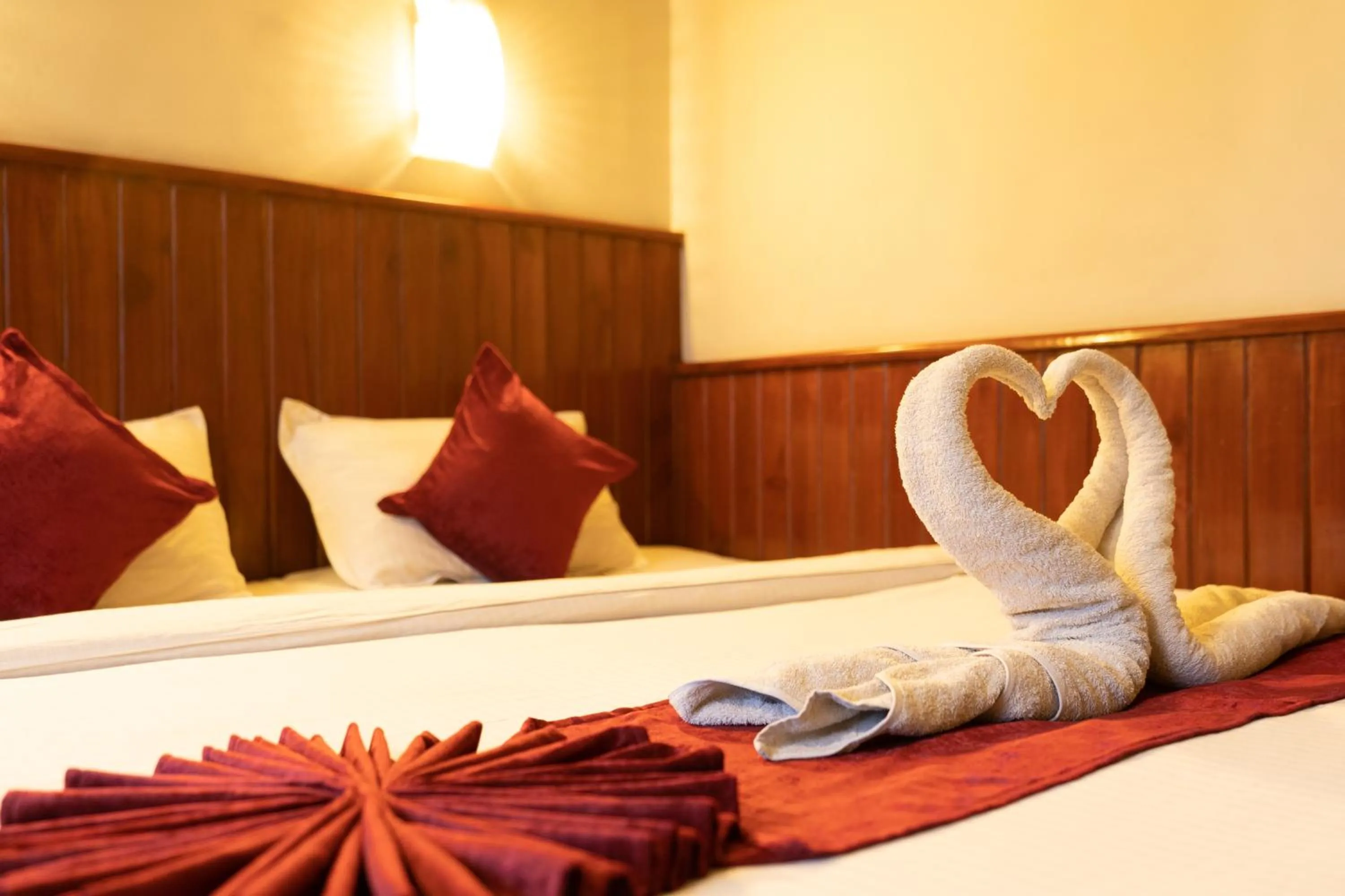 Bed in Mystic Homes Hotel