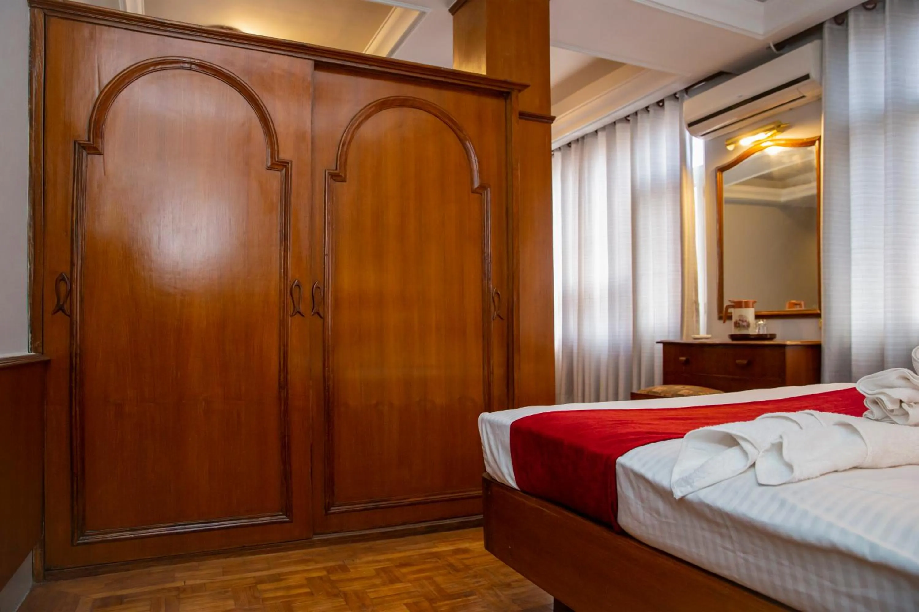 Bed in Mystic Homes Hotel