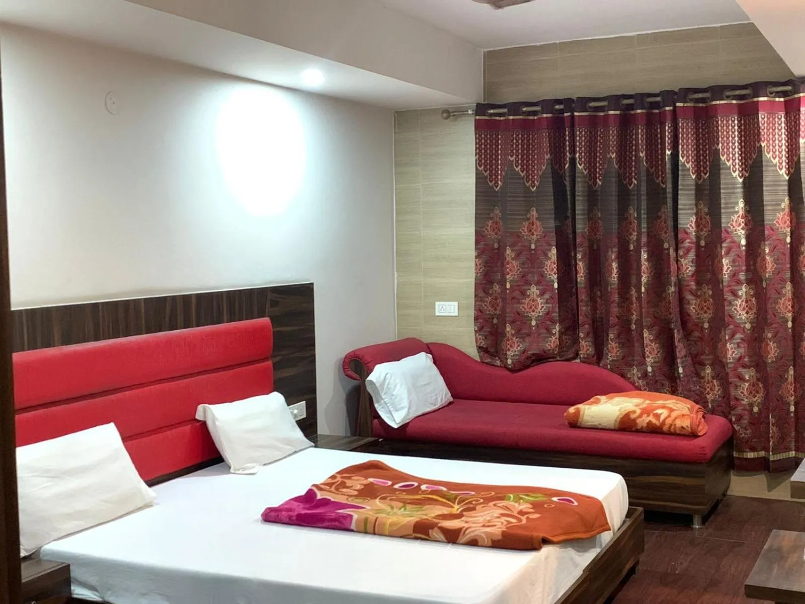 Seating area, Bed in Hotel Sukhman Residency