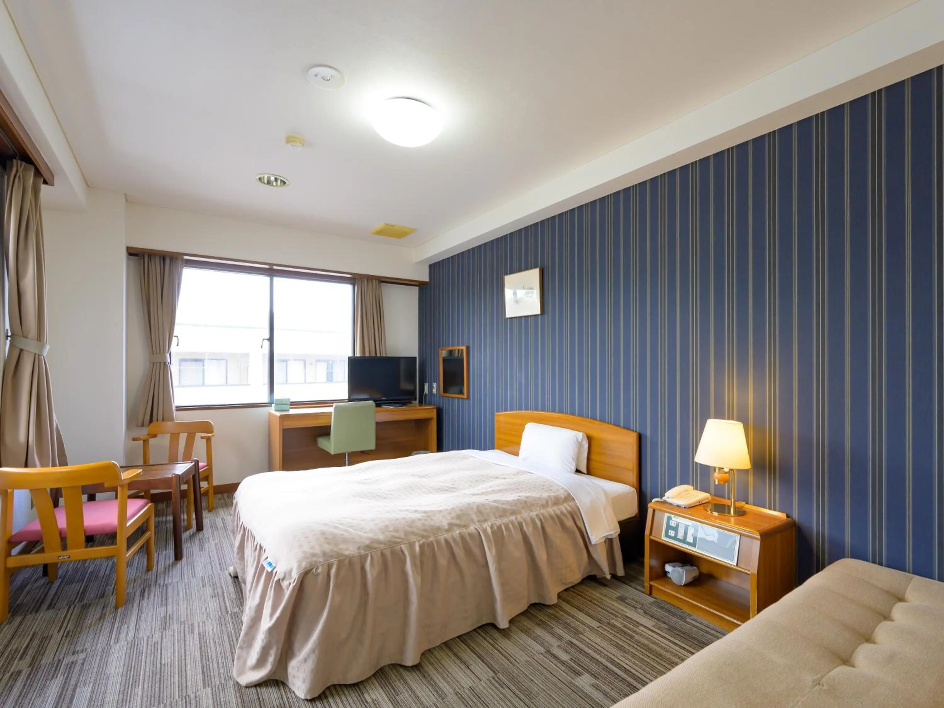 Photo of the whole room, Bed in Hisai Green Hotel