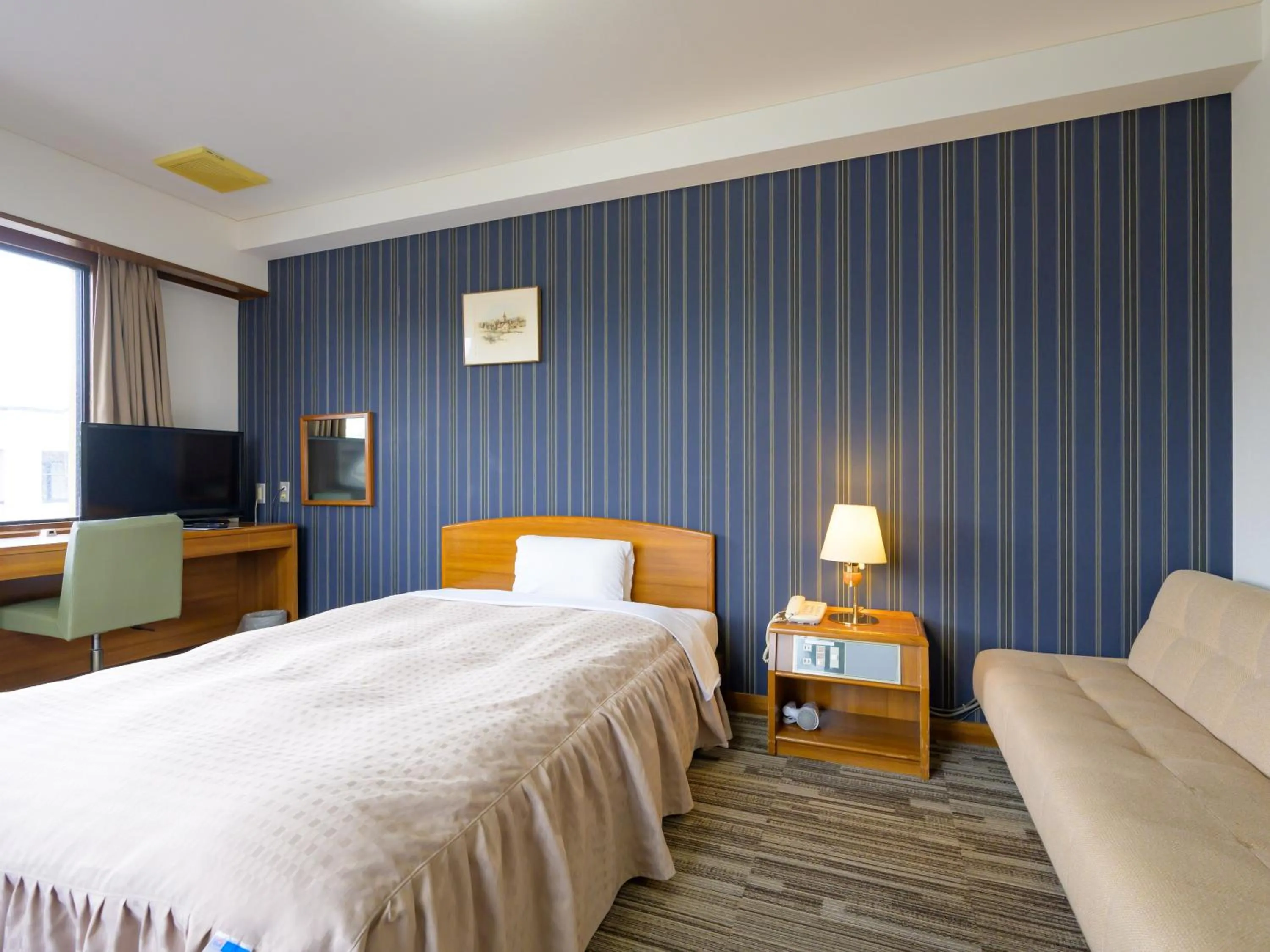 Photo of the whole room, Bed in Hisai Green Hotel