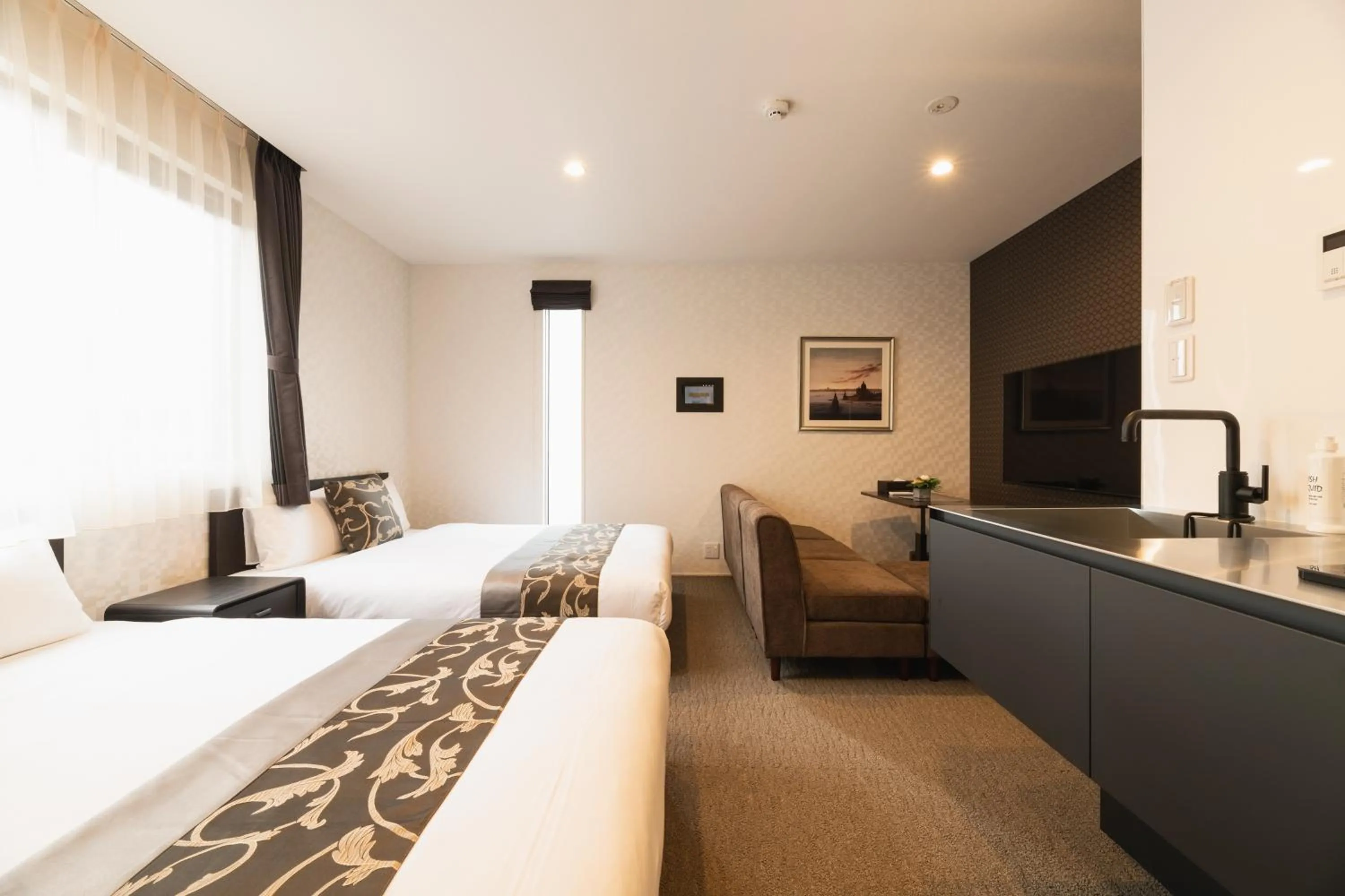 Photo of the whole room, Bed in GRAND BASE Nagasaki Ekimae