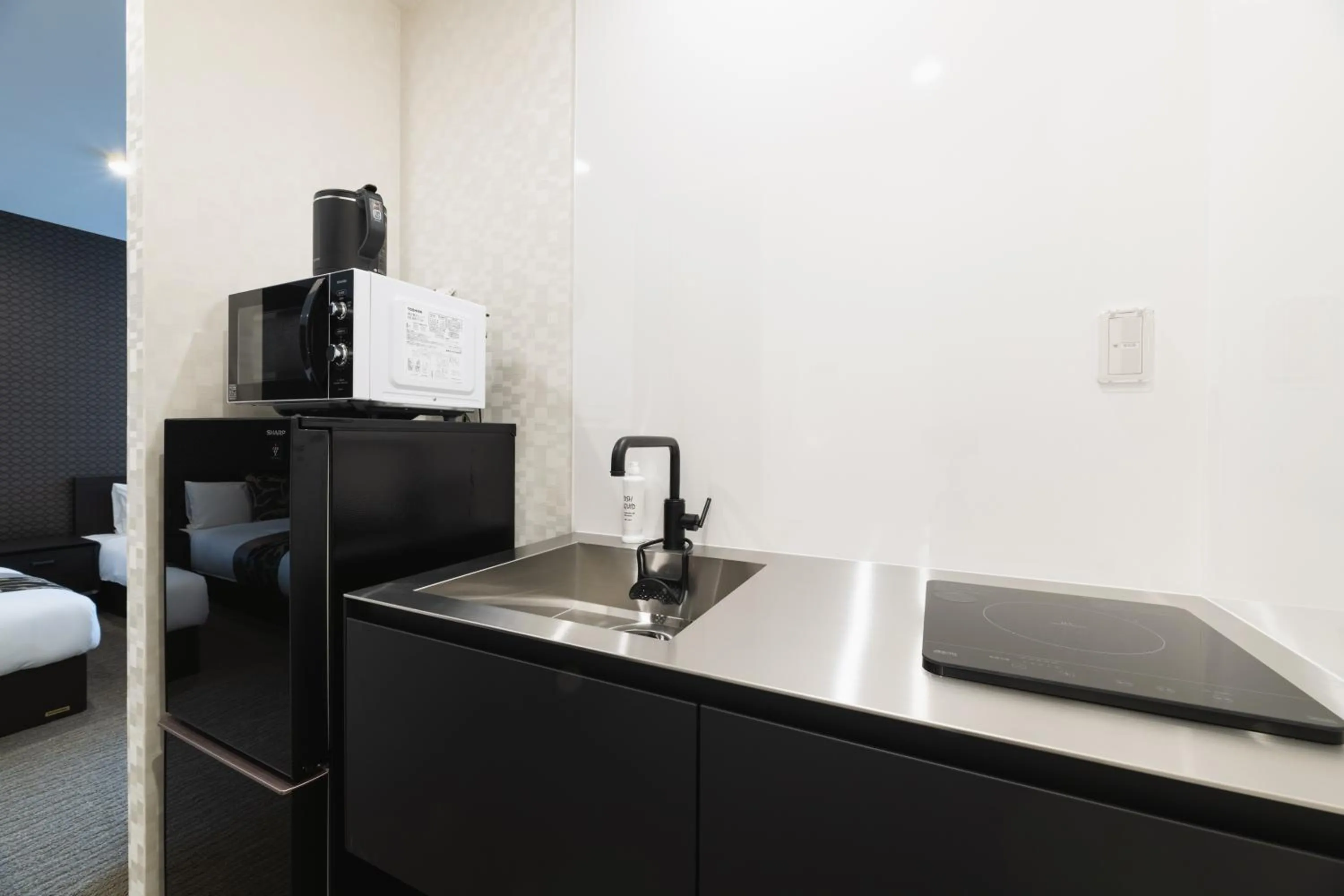 Kitchen or kitchenette in GRAND BASE Nagasaki Ekimae