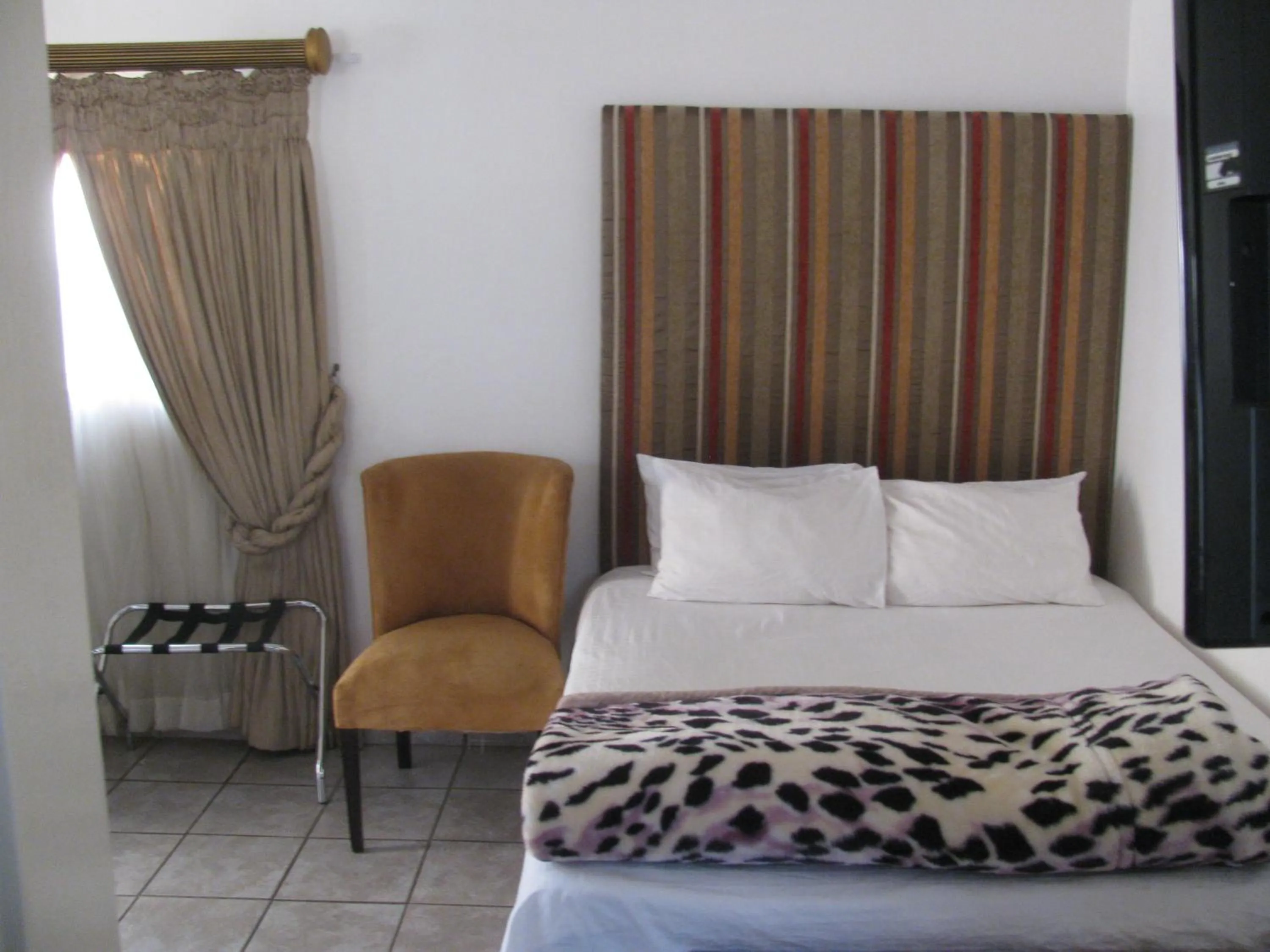 Bed in Bruno Comfort Suites