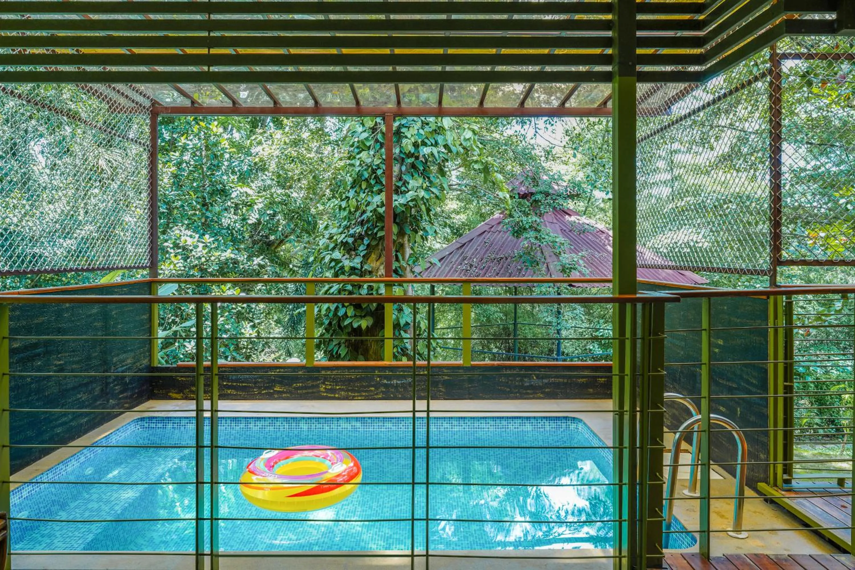 Pool view in Kuruva Island Resort And Spa - By KABINI BREEZE