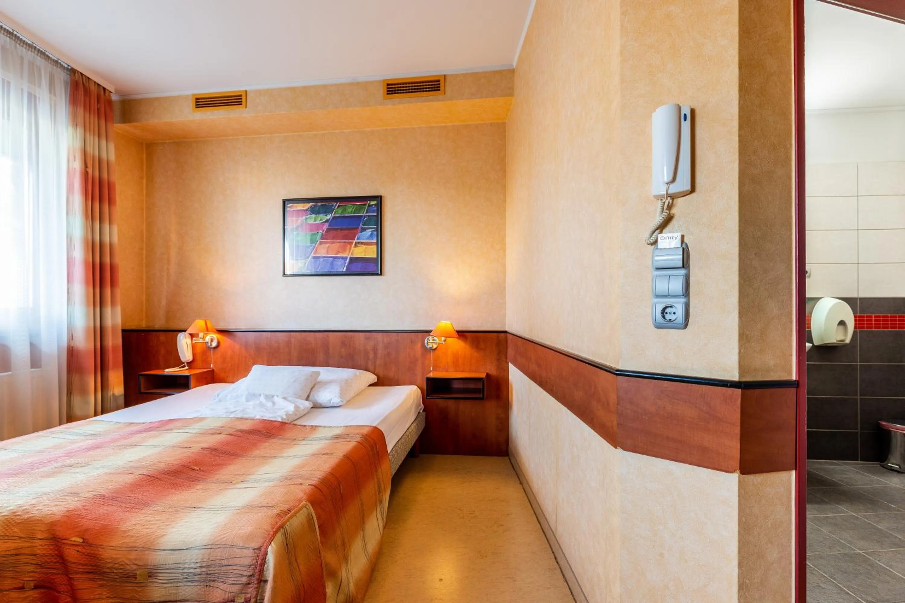 Bed in Corner Motel