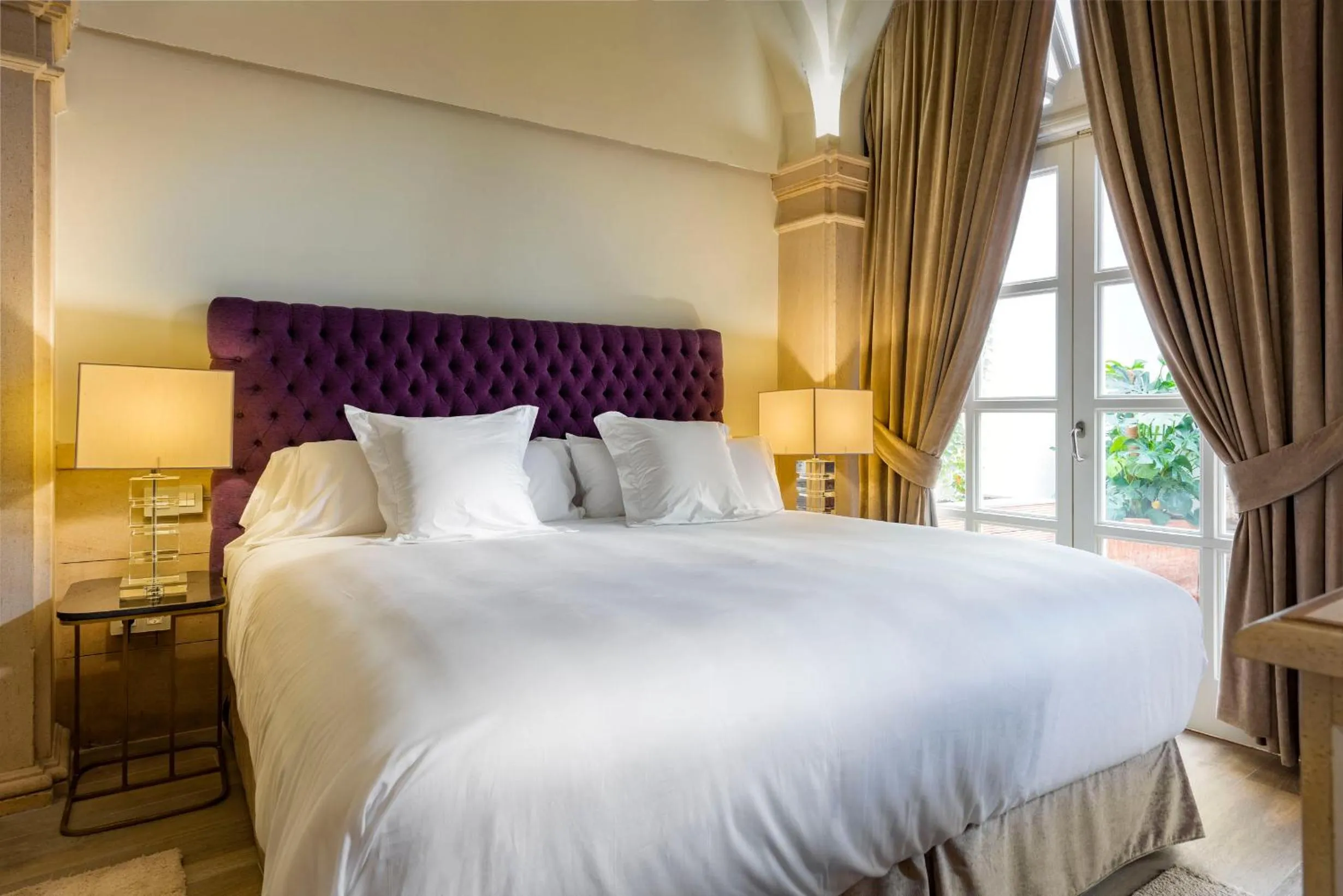 Bed in Casa de Triana Luxury Suites by Casa del Poeta