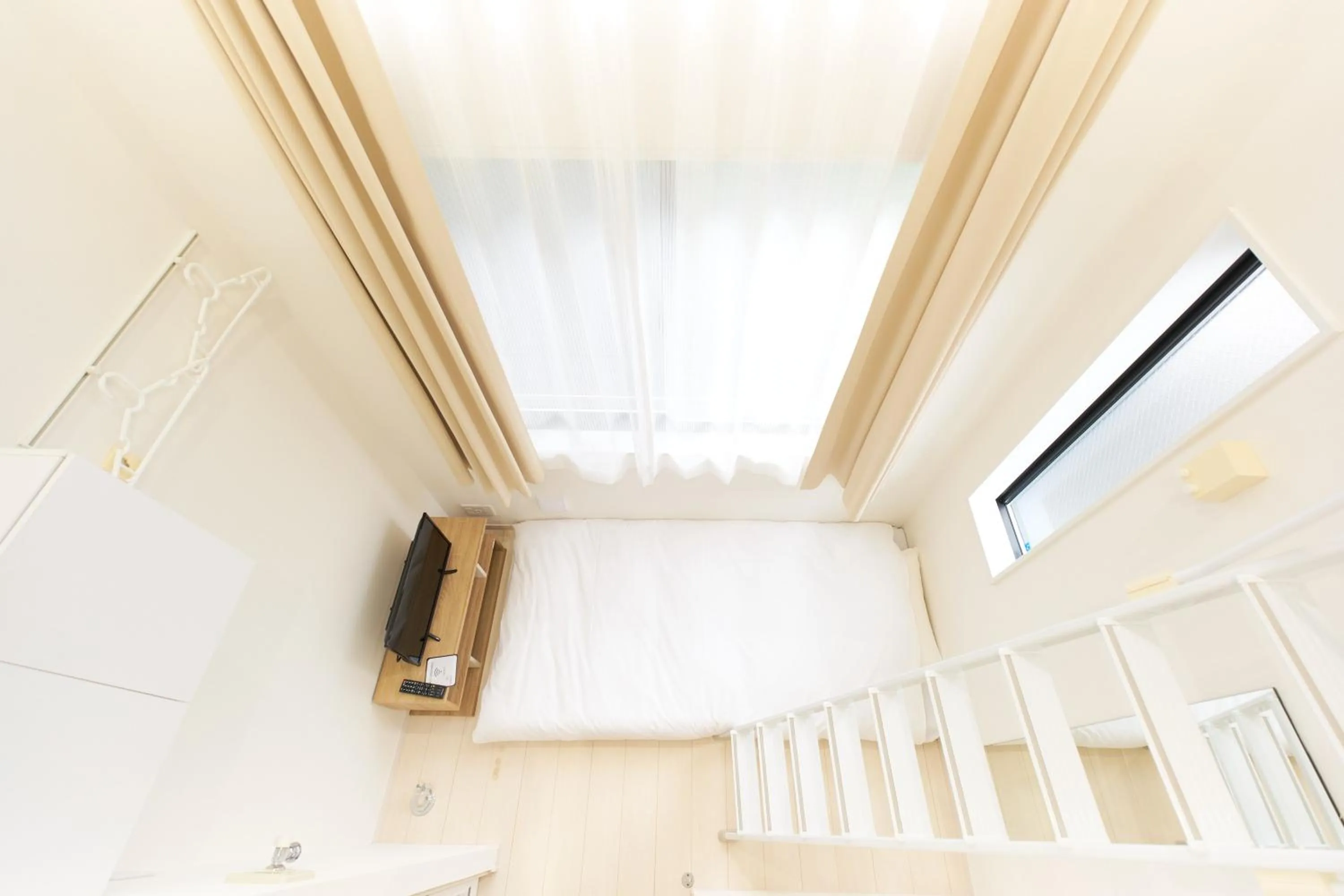 Bed in Nano North Shinjuku Apartment by Tranova
