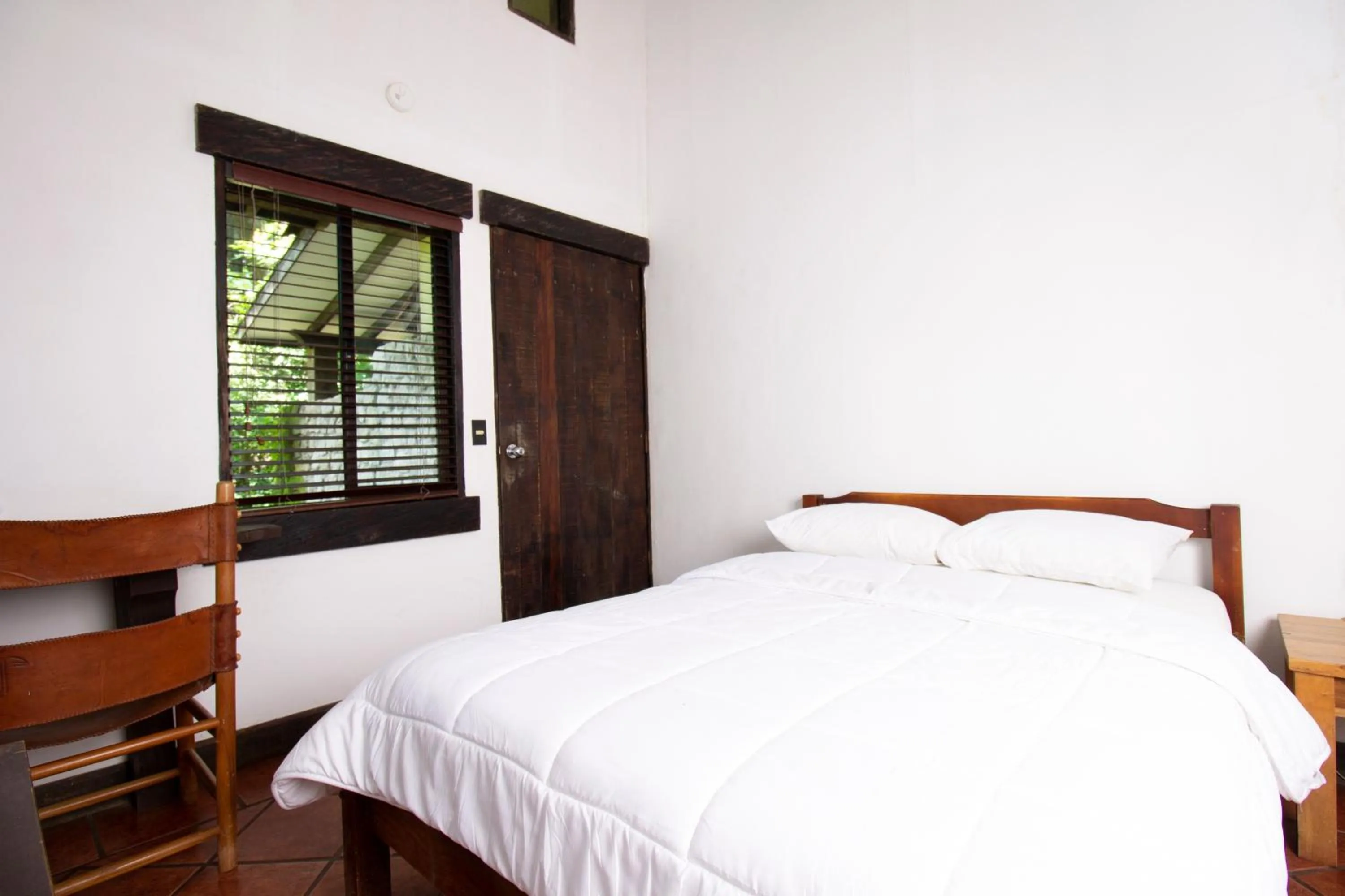 Bed in Hacienda La Pacífica Eco-Lodge