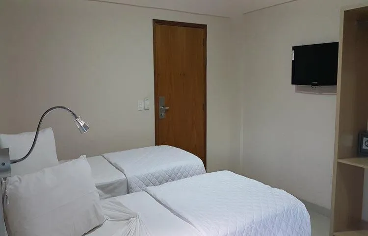 Communal lounge/ TV room, Bed in Emirates Hotel & Suites