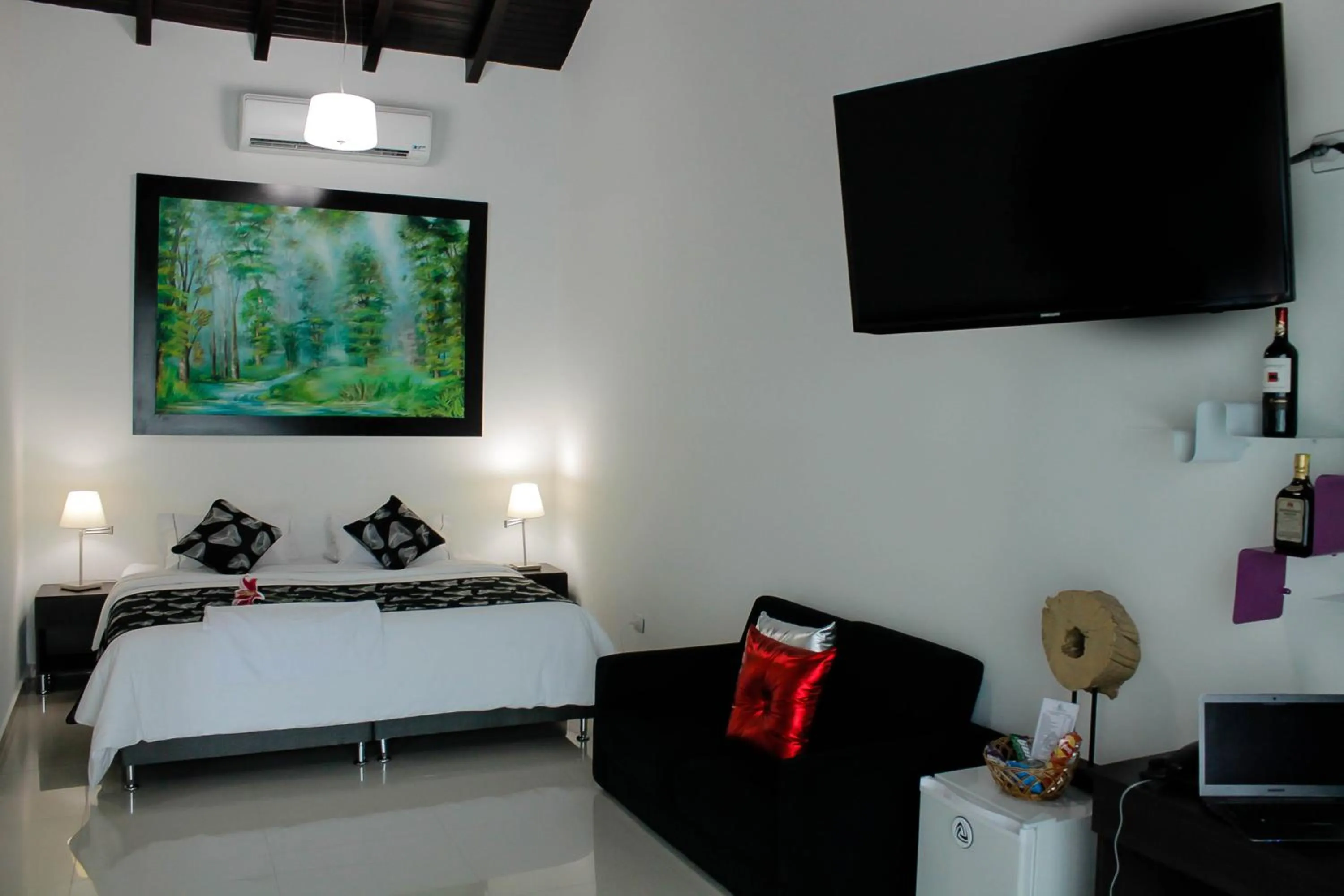 Living room, Bed in La Cabrera Hotel Boutique