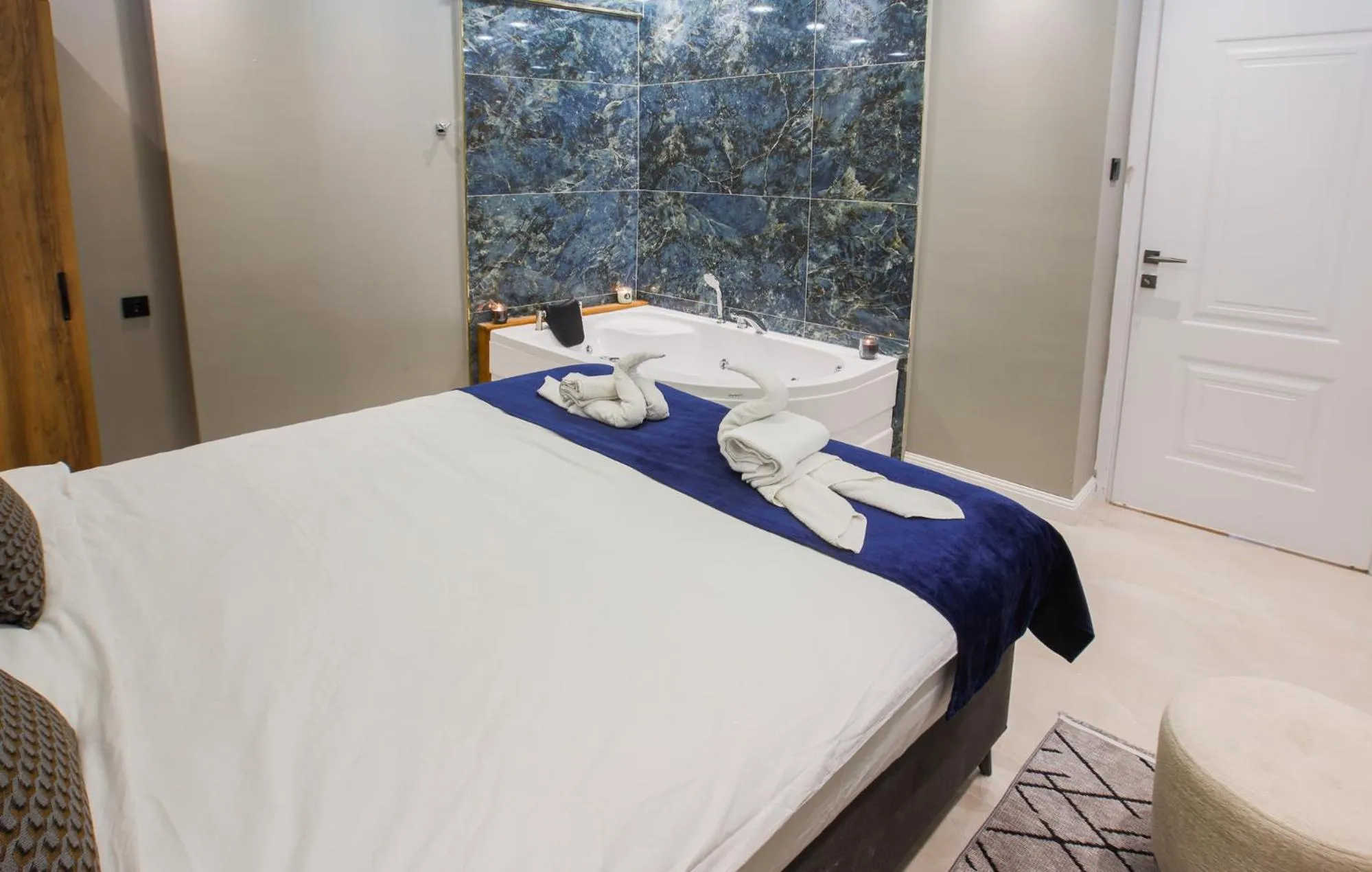 Photo of the whole room, Bed in Stone Suites