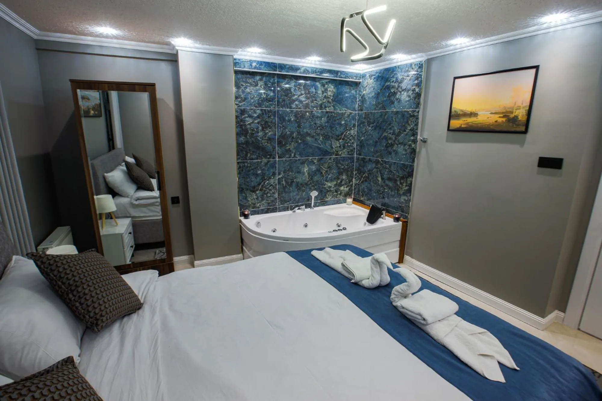 Bath, Bed in Stone Suites