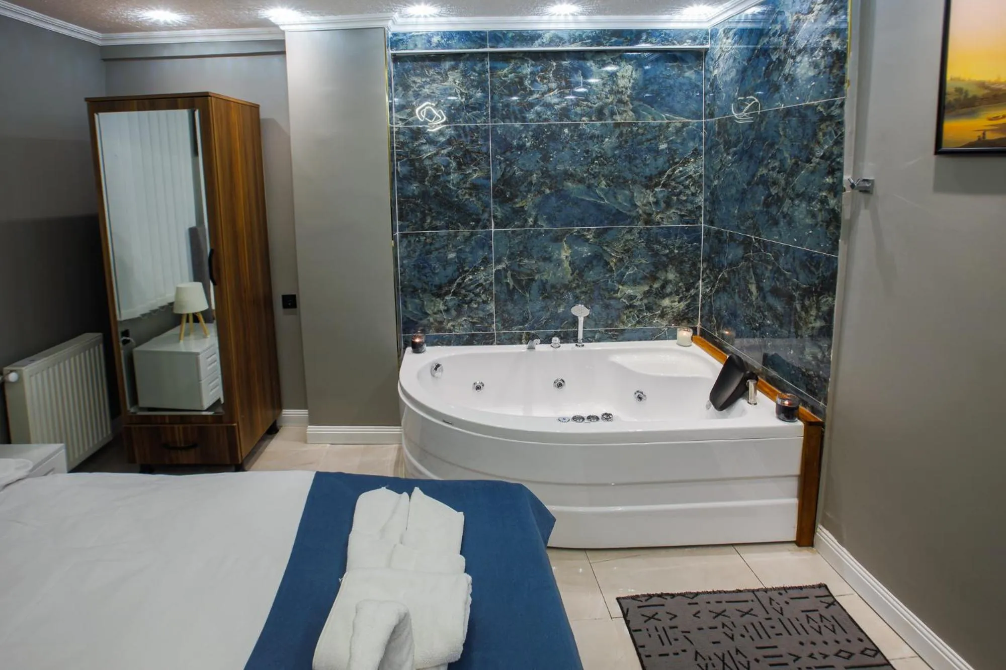 Photo of the whole room, Bed in Stone Suites