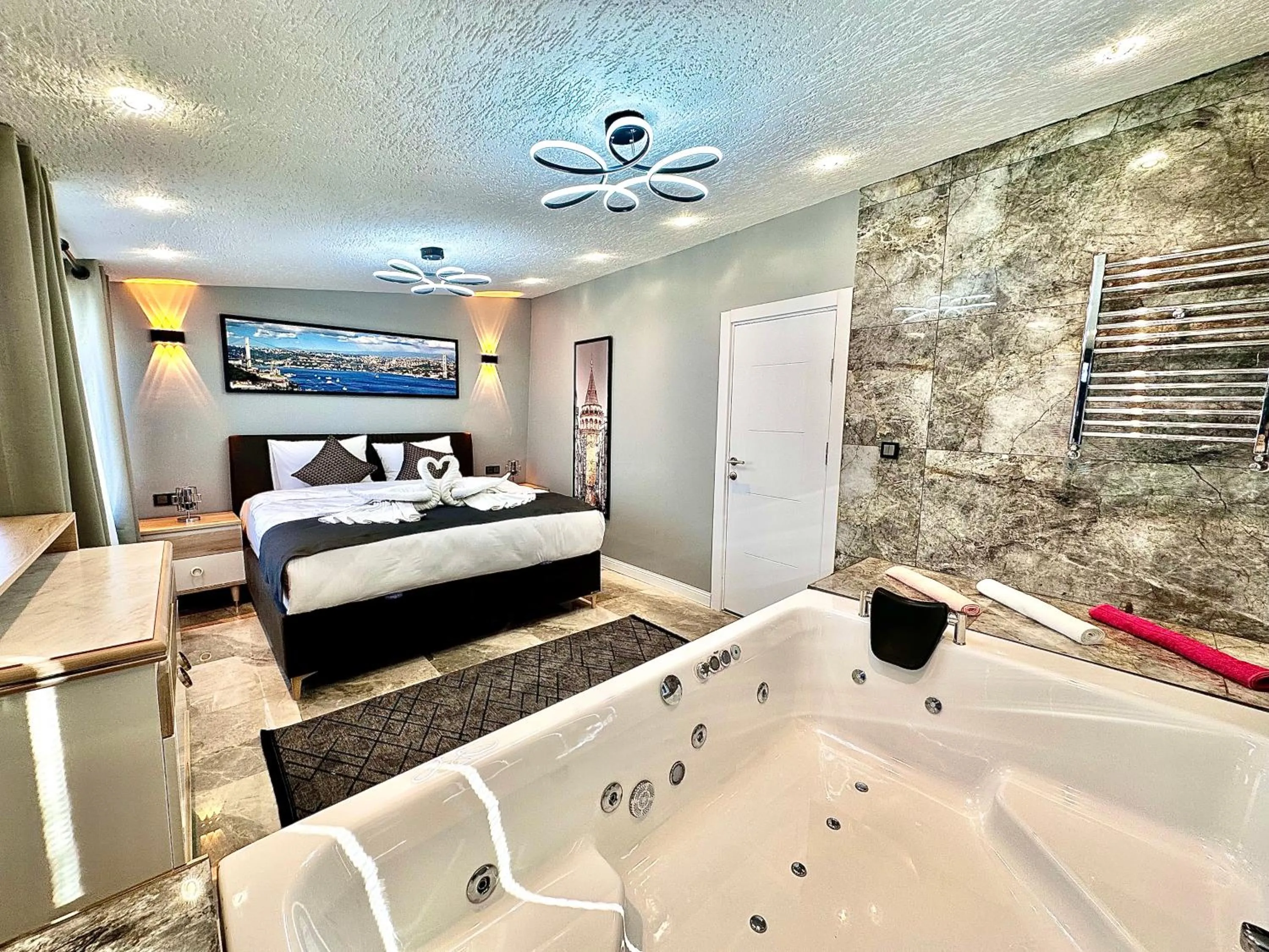 Seating area, Bed in Stone Suites