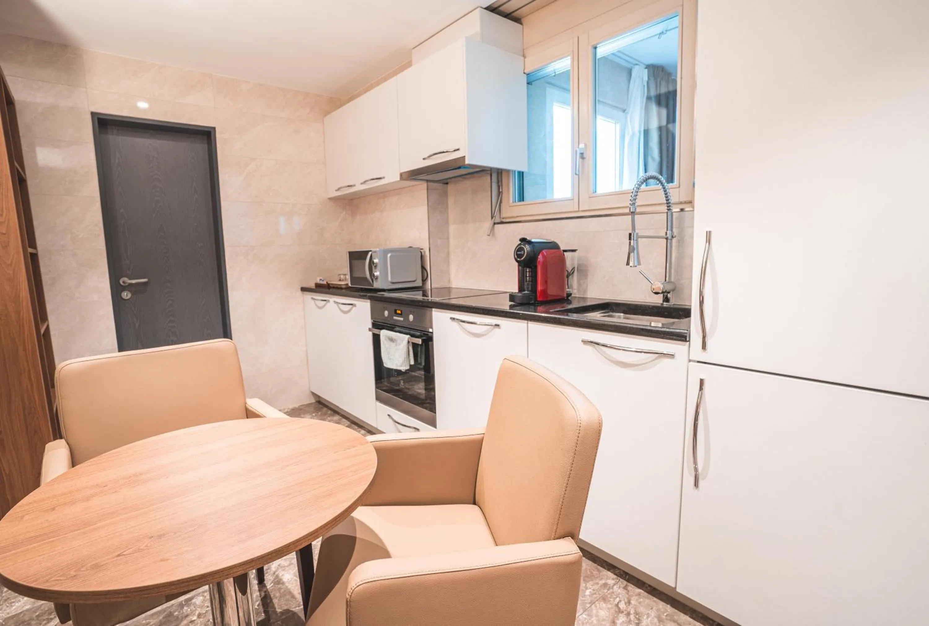 Kitchen or kitchenette in My Home Hotel - Free Parking