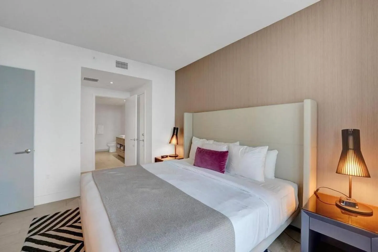 Bed in Amazing Apartments at H Beach House