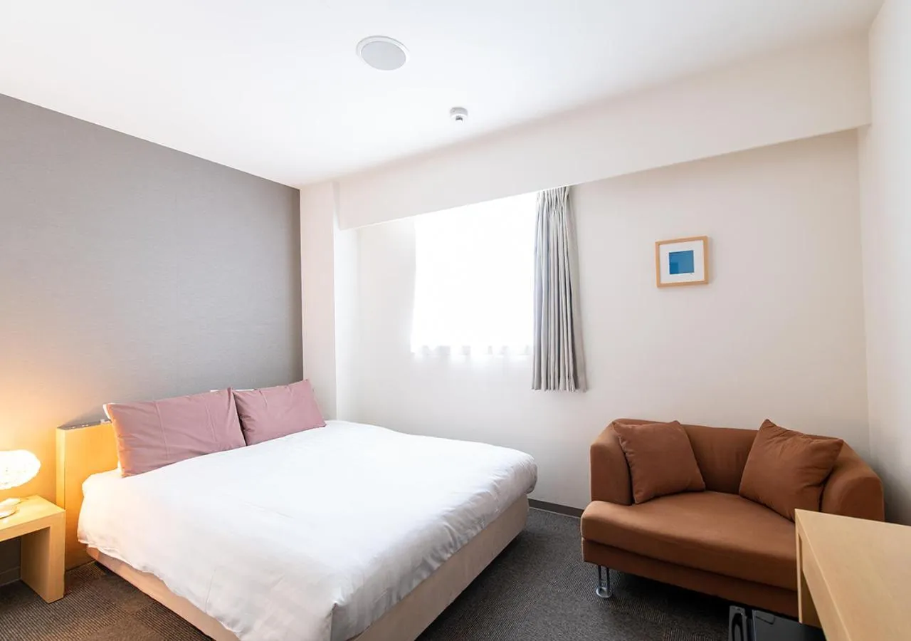 Photo of the whole room, Bed in Hotel day by day