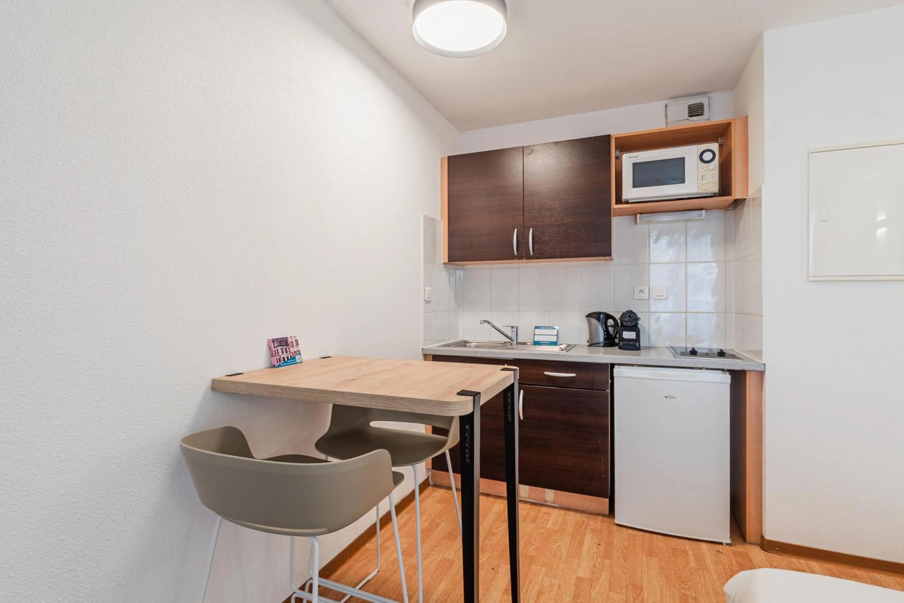 Kitchen or kitchenette in Residhotel Mulhouse Centre