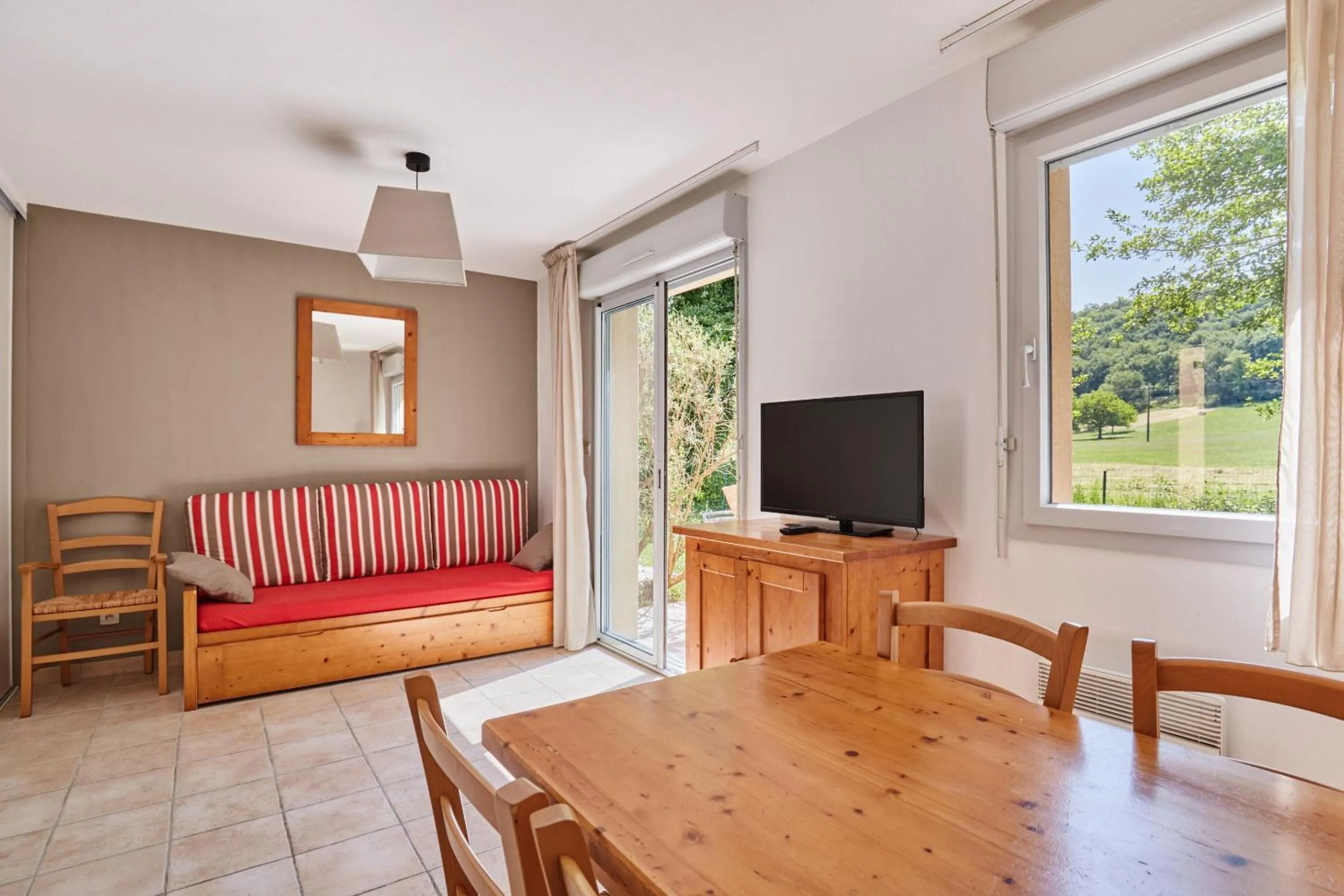 Seating area in Résidence Odalys Le Hameau du Moulin