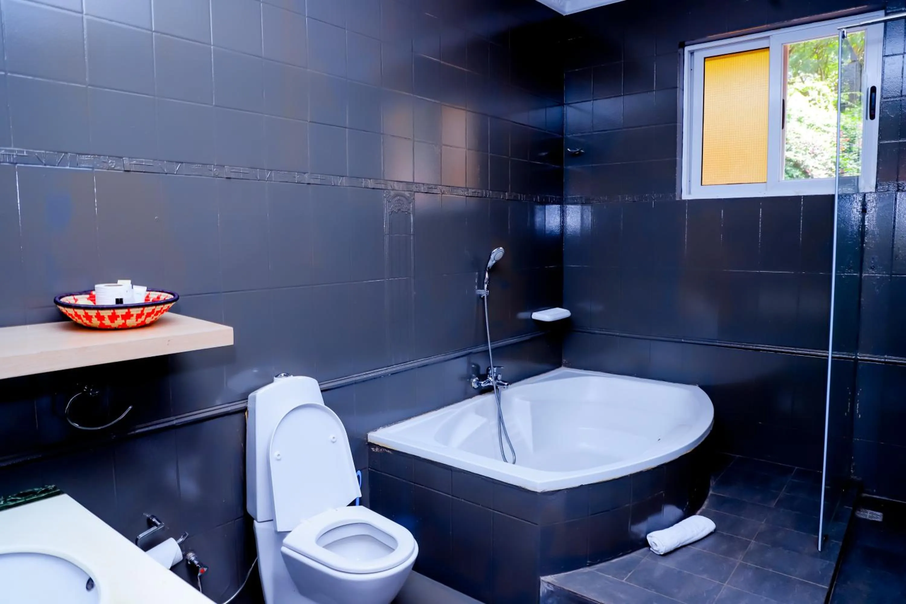 Shower in Amata n'Ubuki Boutique Hotel Ltd