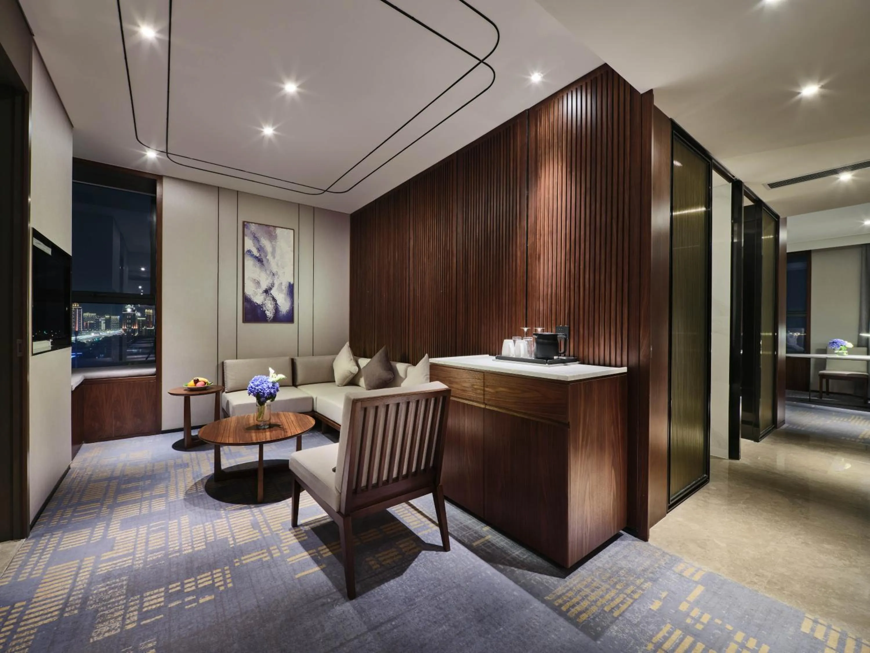 Living room in Crowne Plaza Wuhan Development Zone by IHG