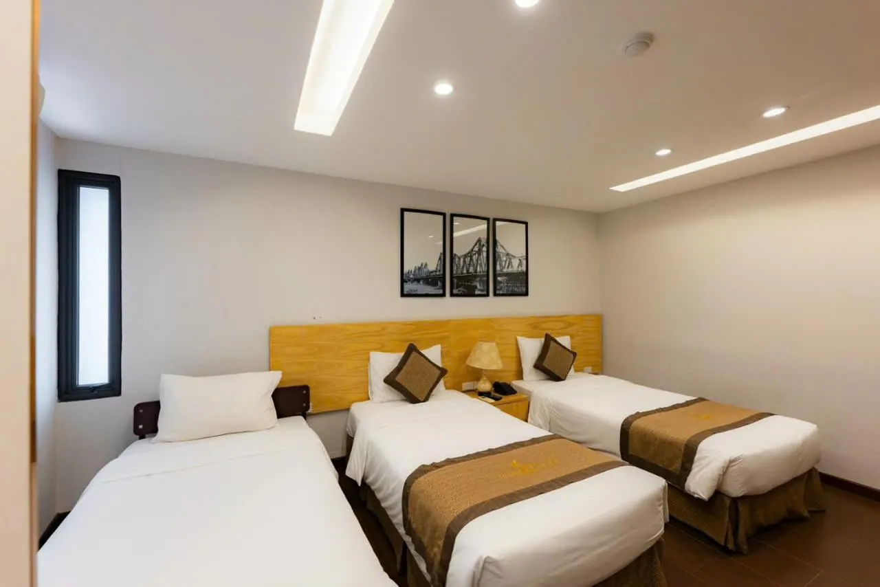 Bed in Riverside Hanoi Hotel