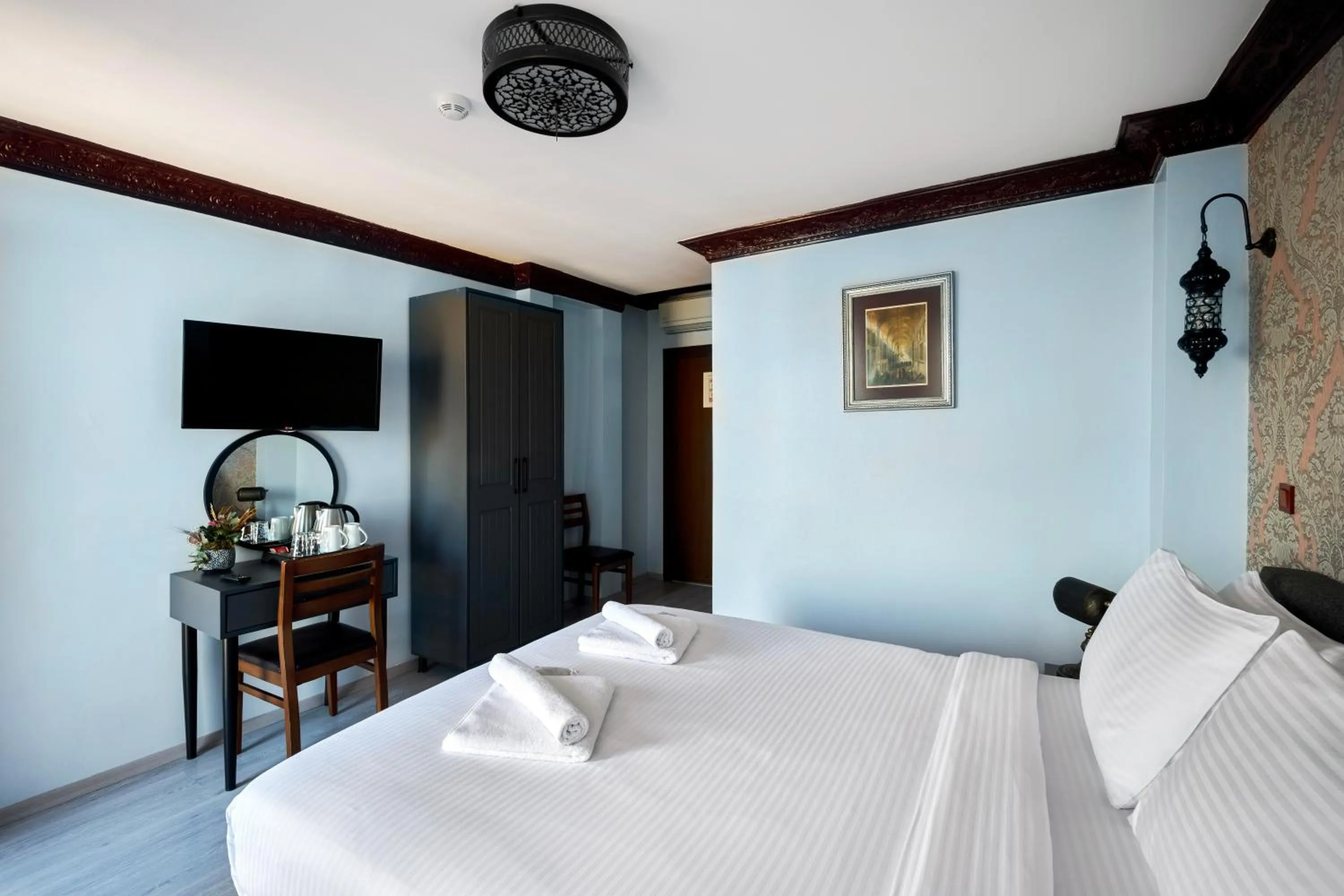 TV and multimedia, Bed in Mytra Hotel