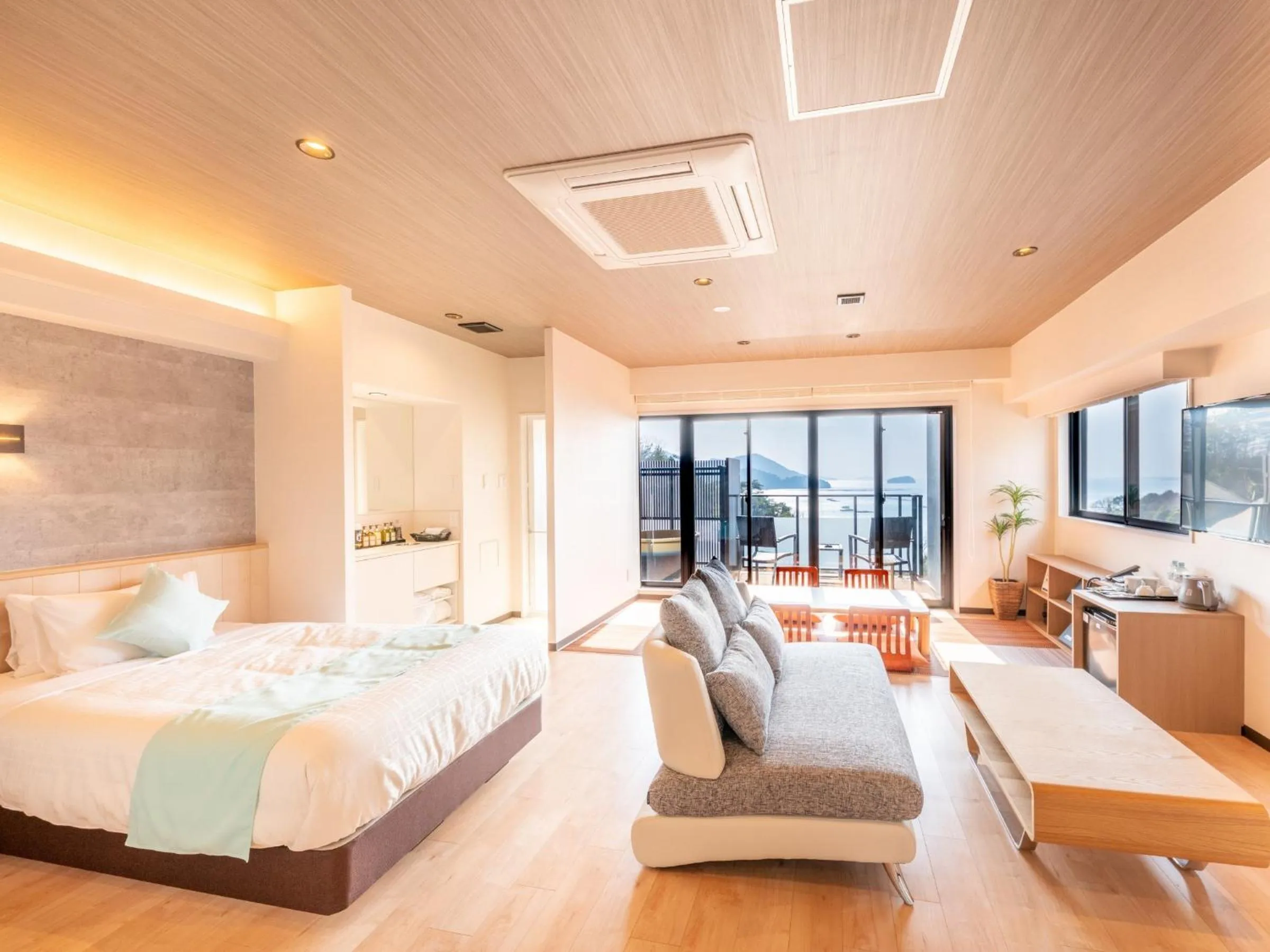 Bed in LiVEMAX RESORT Miyahama Ocean View