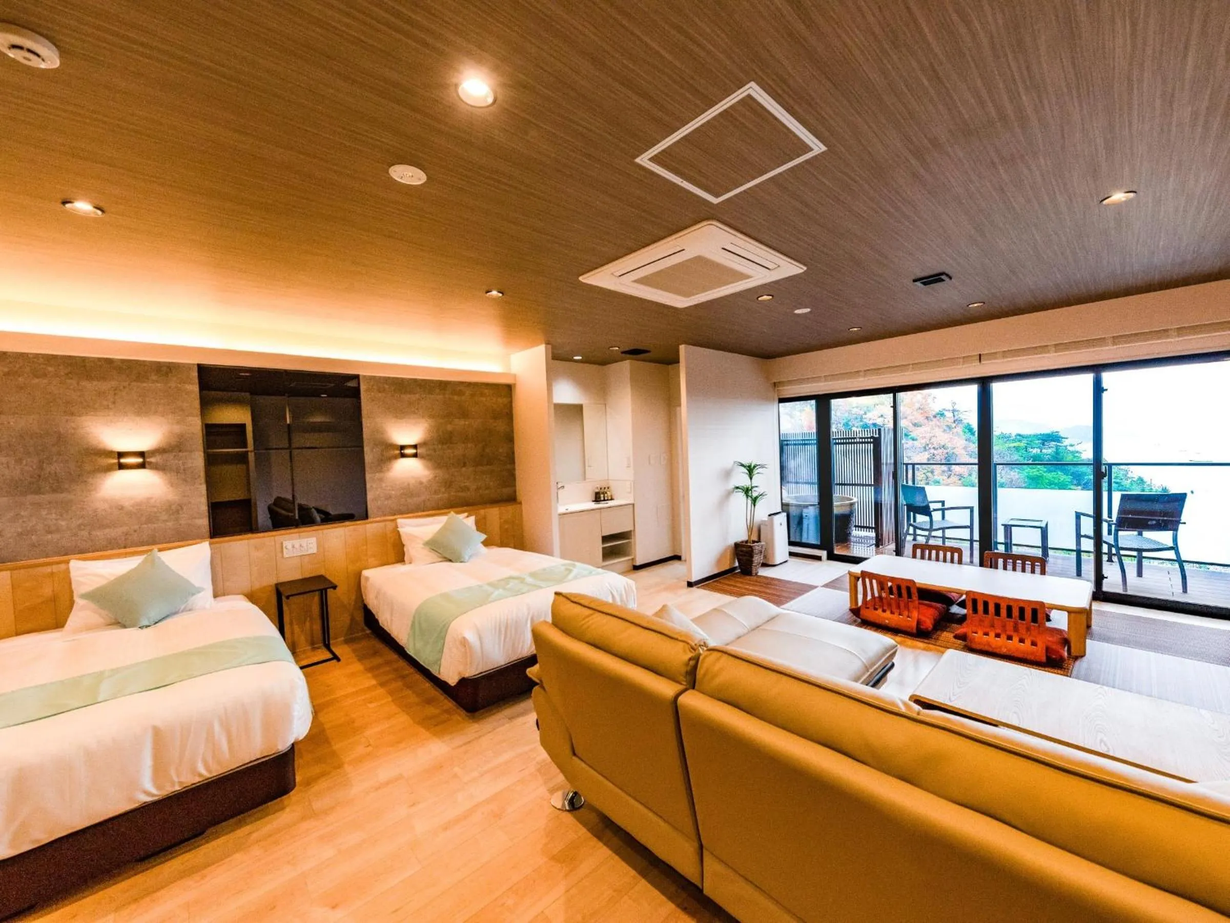 Bed in LiVEMAX RESORT Miyahama Ocean View