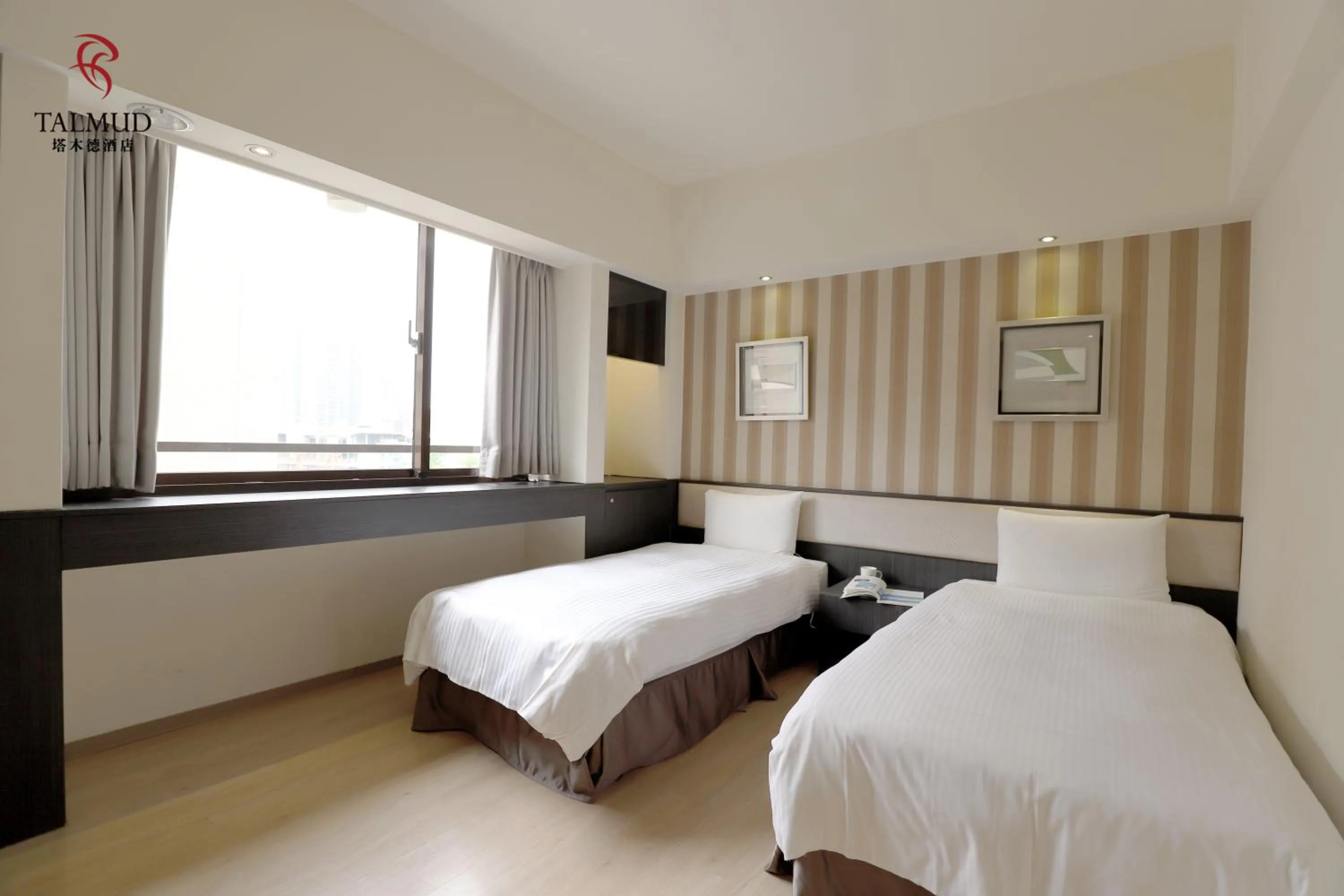 Photo of the whole room, Bed in Talmud Hotel Taichung