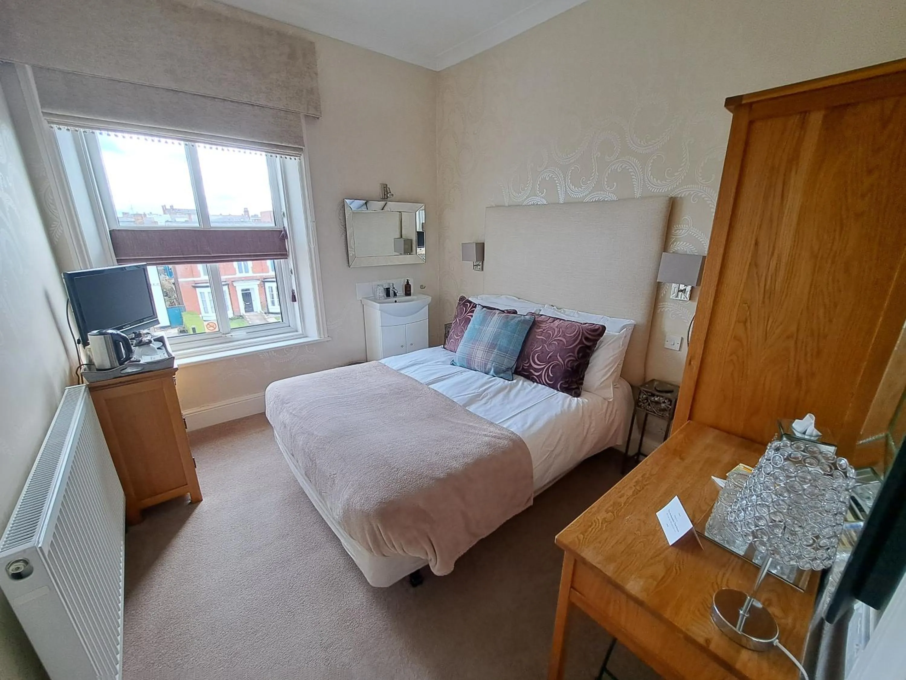 Bed in The Ambassador Townhouse