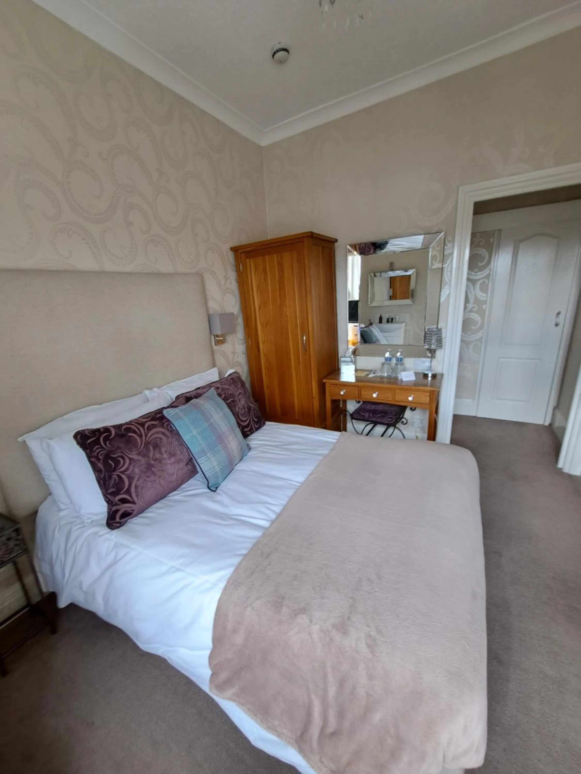 Bed in The Ambassador Townhouse