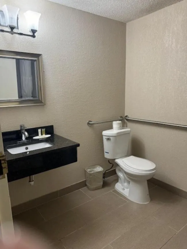 Bathroom in Ramada Plaza by Wyndham Charlotte South End Airport