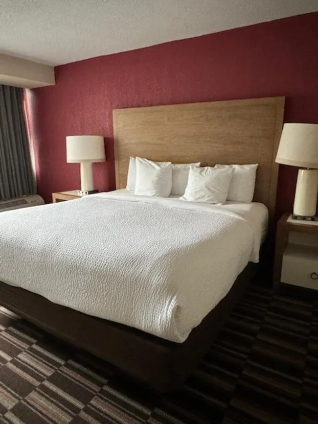 Bed in Ramada Plaza by Wyndham Charlotte South End Airport