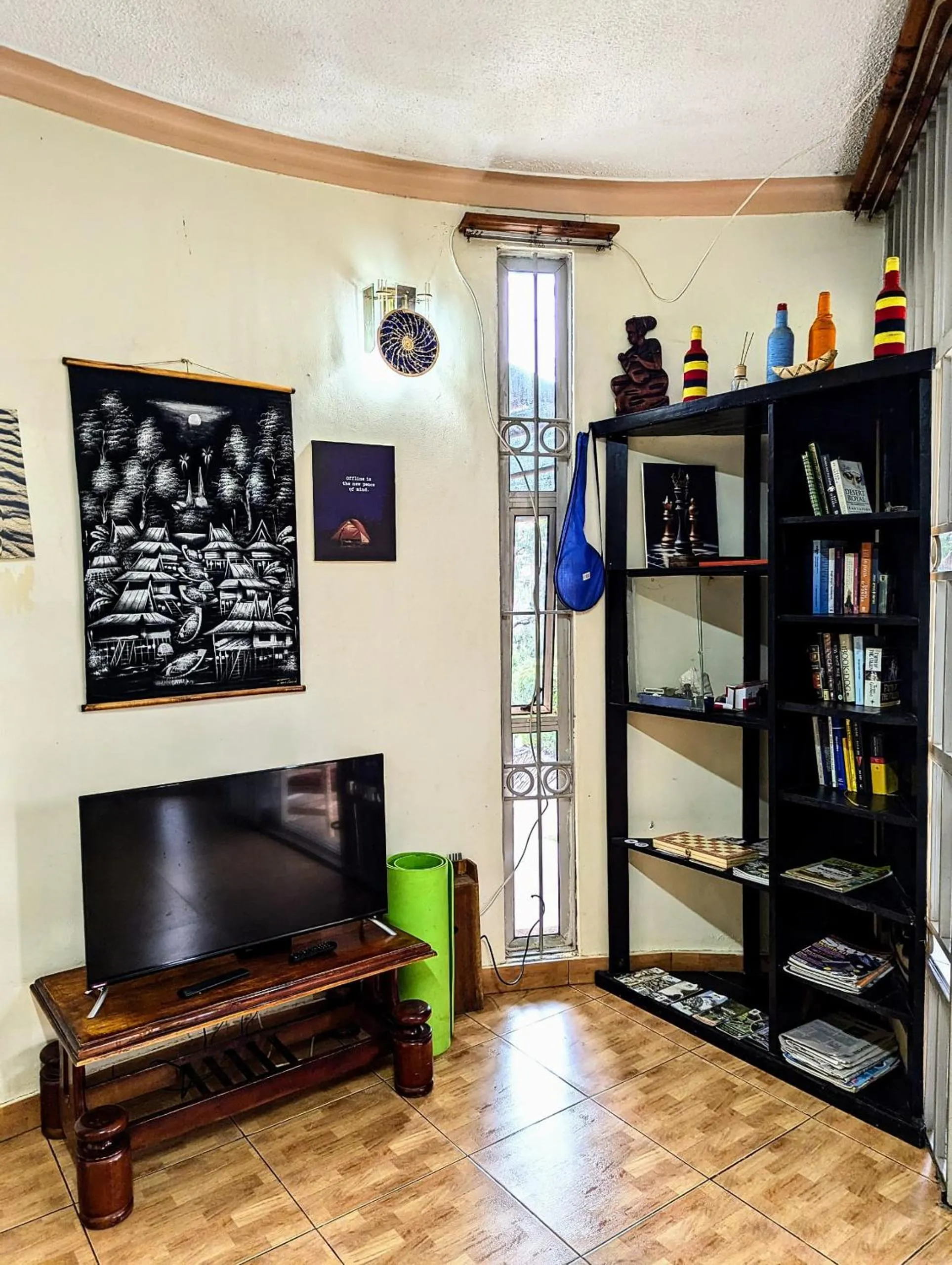 Communal lounge/ TV room in Acacia Villa Kampala
