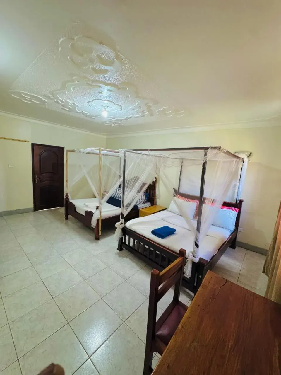 Quadruple Room with Shared Bathroom - single occupancy in Acacia Villa Kampala Quadruple Room with Shared Bathroom - single occupancy in Acacia Villa Kampala
