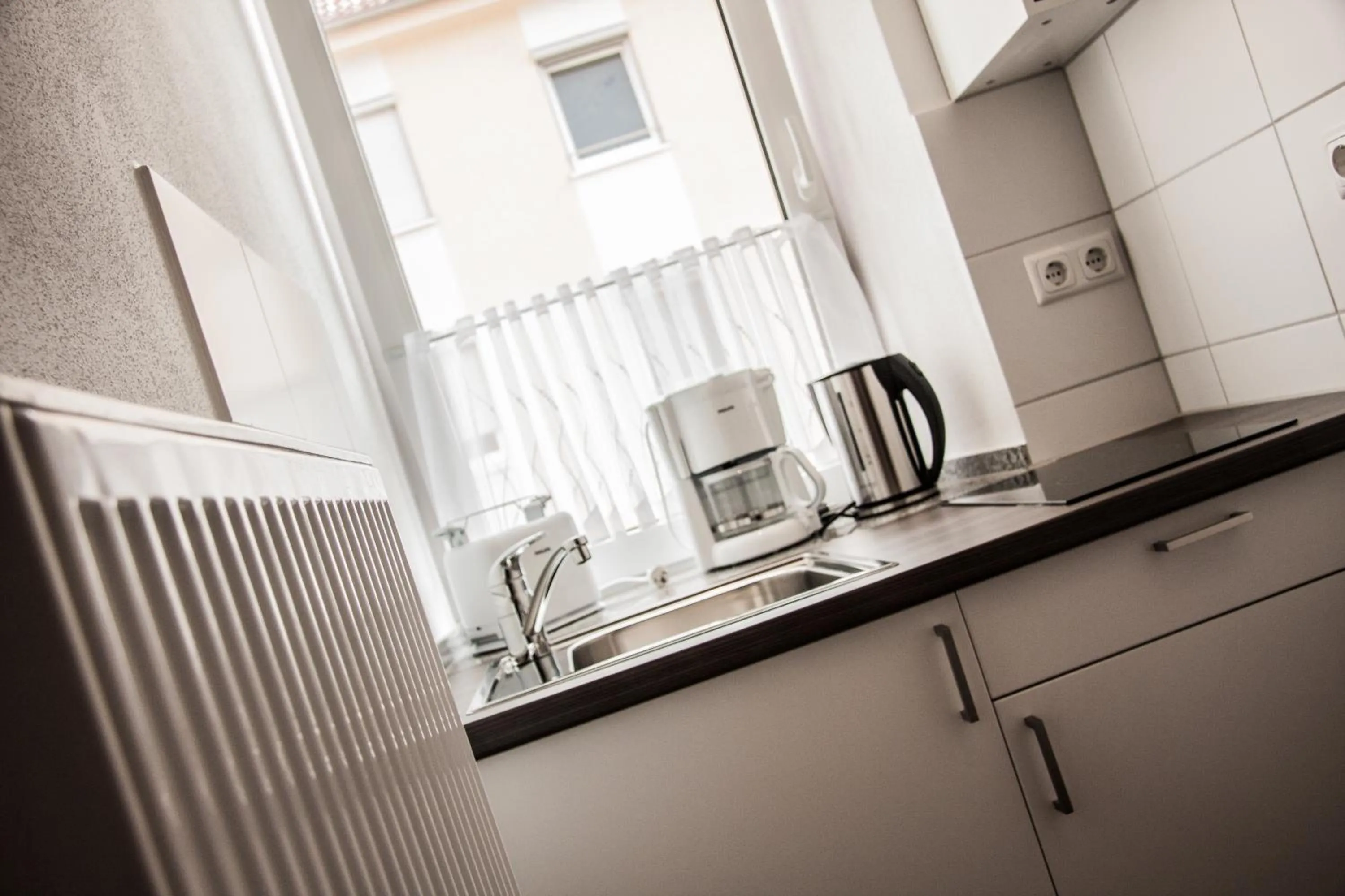 Kitchen or kitchenette in Aparthotel - Stadtvilla Premium