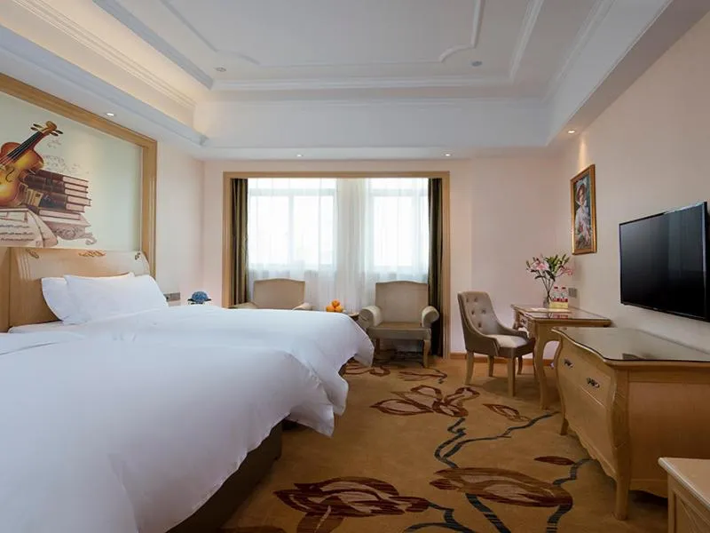 Bed in Vienna International Hotel (Fangchenggang Administration Center High-speed ​​Railway Station)