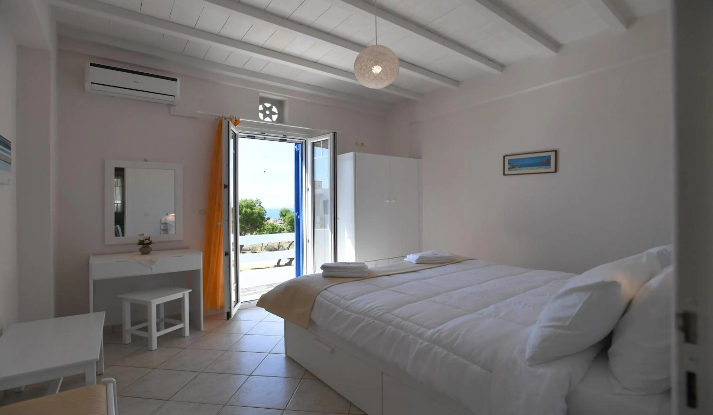 Bed in Nostos Beachfront Apartments & Studios