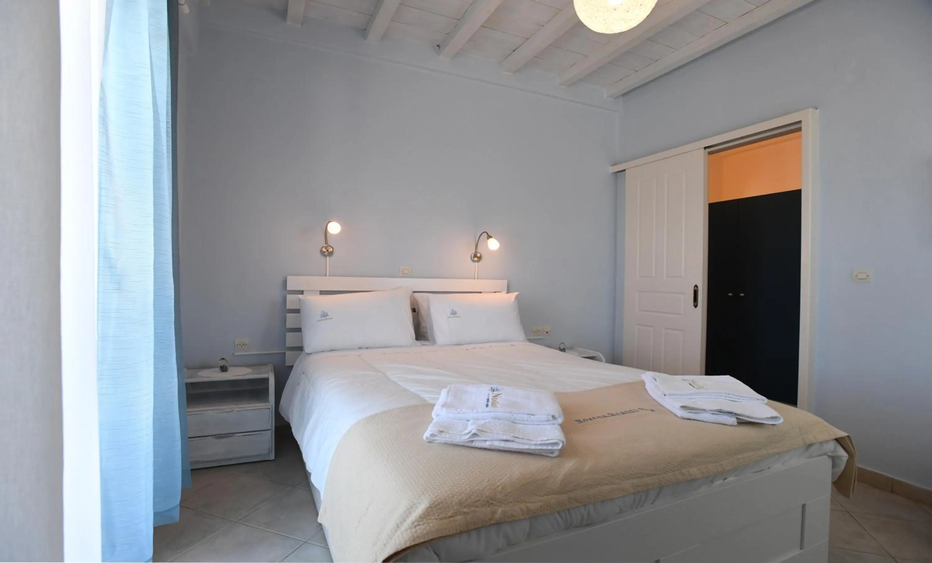 Bed in Nostos Beachfront Apartments & Studios
